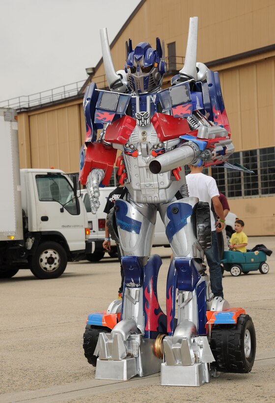 Optimus Prime attended the 2011 Joint Service Open House at Joint Base Andrews representing one of the vendors, Heroes For Hire.  JSOH affords members of the public an excellent opportunity to meet and interact with the men and women of the Armed Forces and to showcase military equipment from the Navy, Marines, Army, Air Force, and Coast Guard.  JSOH is planned and conducted by Total Force; Active, Guard, Reserve, Civilian employees, as well as retirees and family. (U.S. Marine Corps photo)