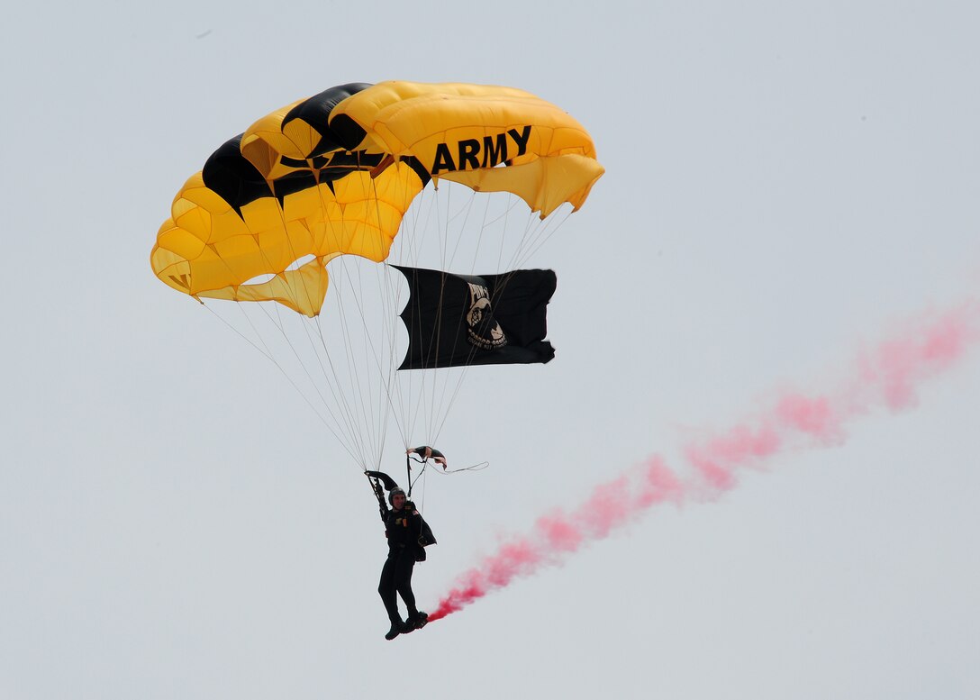 Sergeant 1st Class Dustin Peregrin, U.S. Army Golden Knights, descends to show center during the 2011 Joint Service Open House here May 20. JSOH affords the public an opportunity to meet the men and women of the Armed Forces and see military equipment from the Navy, Marines, Army, Air Force, and Coast Guard. JSOH is planned and conducted through the efforts of active duty, guard and reserve servicemembers, as well as civilian employees, retirees and family members. (U.S. Air Force photo/Staff Sgt. Nichelle Anderson)