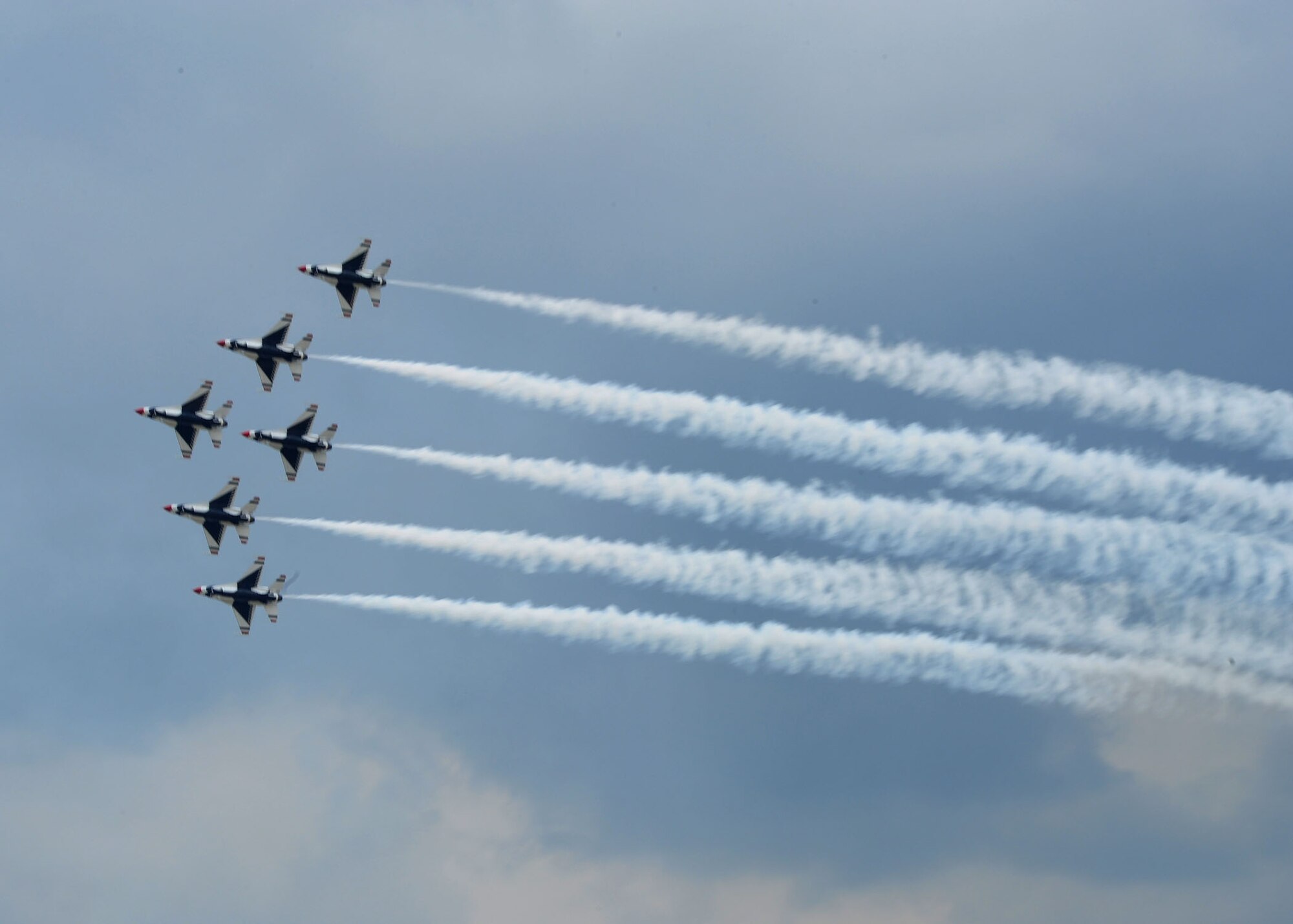 The U.S. Air Force Thunderbirds fly in formation above the 2011 Joint Service Open House here May 20. JSOH affords the public an opportunity to meet the men and women of the Armed Forces and see military equipment from the Navy, Marines, Army, Air Force, and Coast Guard. JSOH is planned and conducted through the efforts of active duty, guard and reserve servicemembers, as well as civilian employees, retirees and family members. (U.S. Air Force photo/Staff Sgt. Nichelle Anderson)