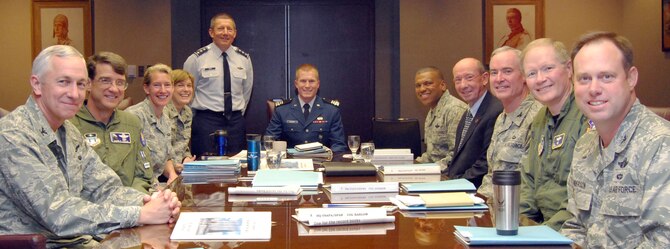 Cadet 1st Class Hal Schmidt (center) takes the Air Force Academy superintendent's seat at the invitation of Academy Superintendent Lt. Gen. Mike Gould (standing) during a meeting of the Academy Board May 20, 2011. Cadet Schmidt was selected by the Academy Board as the top graduate for the Class of 2011 based on his academic, military and physical fitness accomplishments. 

Also pictured are, from left: Col. Paul Pirog, permanent professor for the Department of Law; Col. Mark Wells, permanent professor for the Department of History; Brig. Gen. Dana Born, the dean of the faculty; Col. Tamra Rank, the vice superintendent; Brig. Gen. Richard Clark, the commandant of cadets; Dr. Hans Mueh, the director of athletics; Col. John Andrew, permanent professor for the Department of Mathematical Sciences; Col. Neal Barlow, permanent professor for the Department of Aeronautics; and Col. Richard Anderson, the vice commandant. (U.S. Air Force photo/Don Branum)