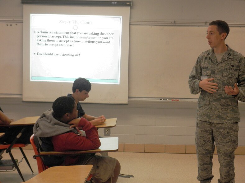 Capt. Matthew C. Deacon, 2nd Bomb Wing Legal office, speaks with Eighth graders about how to present an effective argument in one of Mrs. Felicia Gunn's English classes at Green Acres Middle School in Bossier City, La., May 11. (courtesy photo by Senior Airman Andrew Kaltenmark)