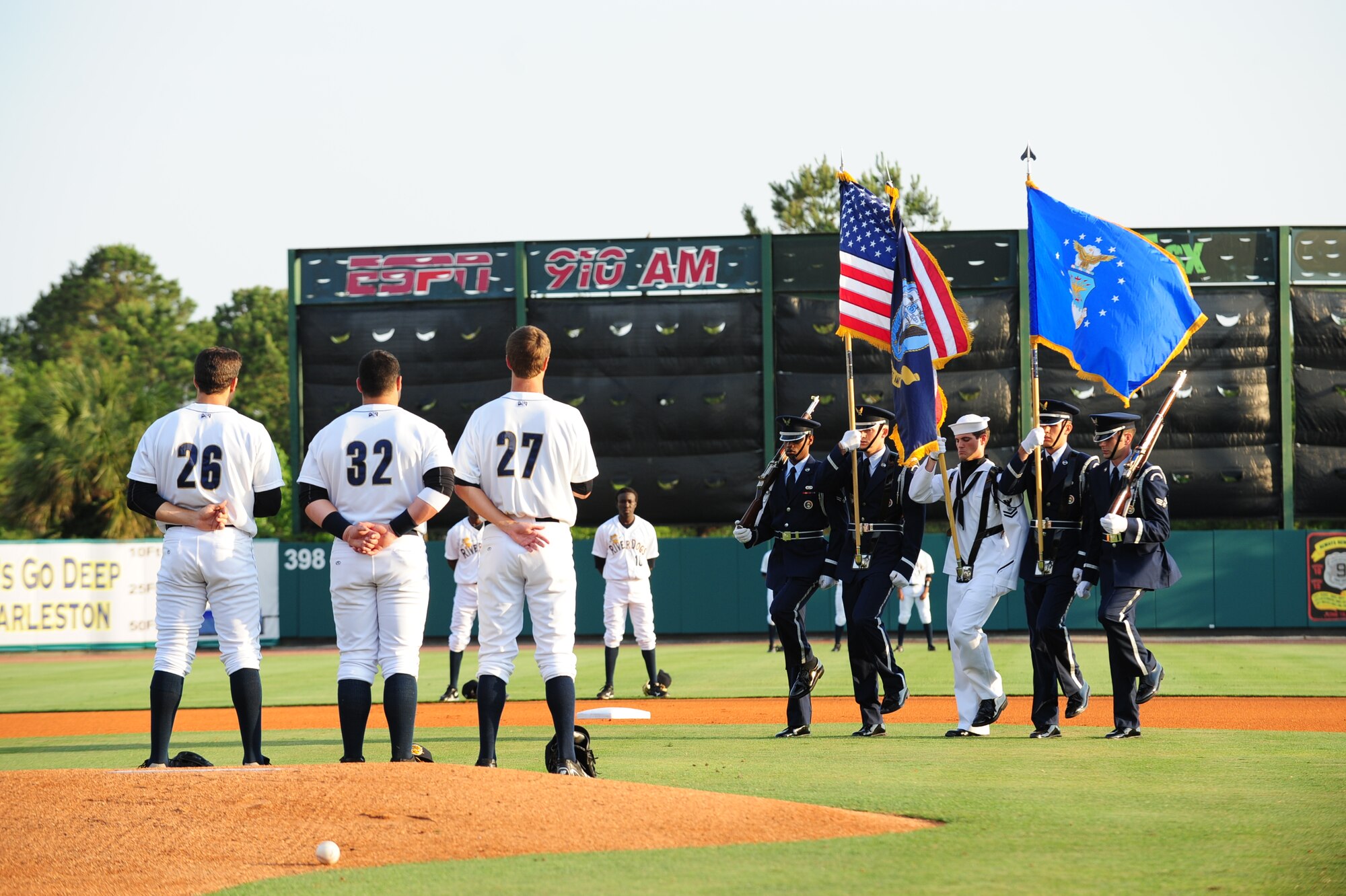 Members of the Joint Base Charleston Honor Guard march onto the Charleston RiverDogs baseball field to present the colors for the Military Appreciation Night opening ceremony May 19, at Joseph P. Riley Jr Park in Charleston, S.C. The Honor Guard members from left to right are, Airman 1st Class Darrell Walton, 437th Maintenance Group, Staff Sgt. Yale Akers, 437th Aircraft Maintenance Squadron, Petty Officer 2nd Class Chase Ferguson, Naval Cargo handling Battalion Four,  Airman 1st. Class Dylan Thomas, 628th Mission Support Group and Senior Airman Josh Bischoff, 15th Airlift Squadron. (U.S. Air Force photo/Tech. Sgt. Chrissy Best)
