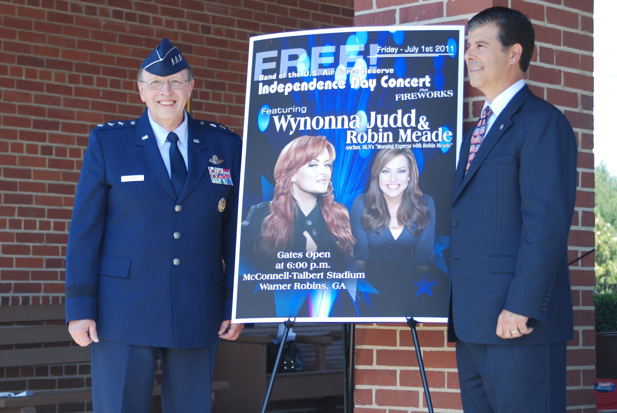 Lt. Gen. Charles E. Stenner Jr., commander of Air Force Reserve Command and Chuck Shaheen, mayor of Warner Robins, unveil the guest artists for the 2011 Independence Day concert. Five-time Grammy winner Wynonna Judd and Robin Meade of HLN's "Morning Express with Robin Meade" are the featured artists for the concert at McConnell-Talbert stadium in Warner Robins July 1. Gates open at 6 p.m. and the concert starts at 8. (U.S. Air Force photo/Mr Bo Joyner)