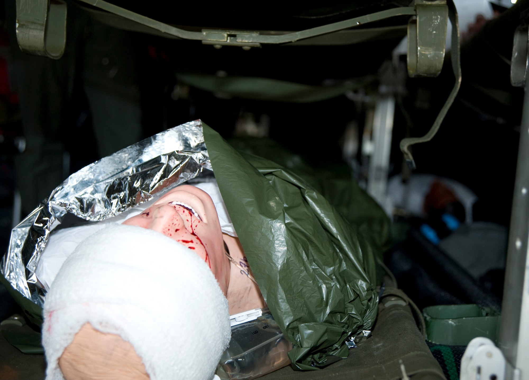 A mannequin, inside an Air Force C-130 Hercules, awaits to be transported to a local hospital May 18, 2011, McConnell Air Force Base, Kan. The mannequin was part of the National Level Exercise 2011 which simulated an earthquake along the New Madrid Fault. McConnell Airmen help process, triage and transport “victims” of the earthquake to area hospitals. (U.S. Air Force photo/Airman 1st Class Armando A. Schwier-Morales)