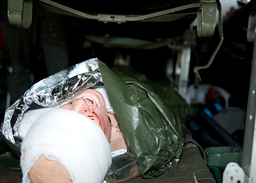 A mannequin, inside an Air Force C-130 Hercules, awaits to be transported to a local hospital May 18, 2011, at McConnell Air Force Base, Kan. The mannequin was part of the National Level Exercise 2011 which simulated an earthquake along the New Madrid Fault. McConnell Airmen help process, triage and transport “victims” of the earthquake to area hospitals. (U.S. Air Force Photo/Airman 1st Class Armando A. Schwier-Morales)