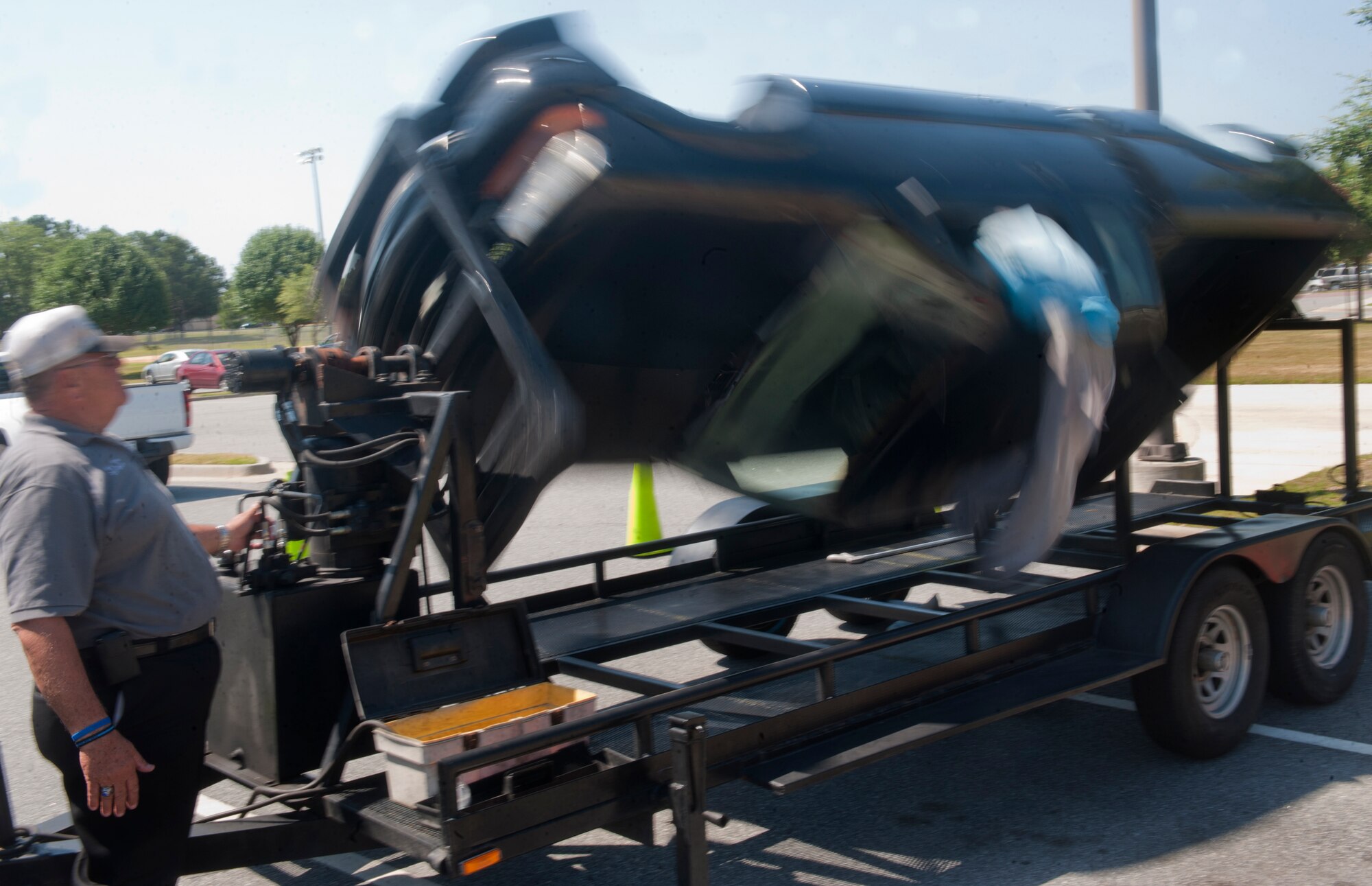 William Hires, Coastal Area Traffic Enforcement Network coordinator, shows the importance of wearing a seatbelt by simulating a vehicle wreck with a roll-over simulator at Moody Air Force Base, Ga., May 20. When riding in a vehicle, a seatbelt can be the difference between life and death. (U.S Air Force photo/Airman 1st Class Douglas Ellis)(RELEASED)
