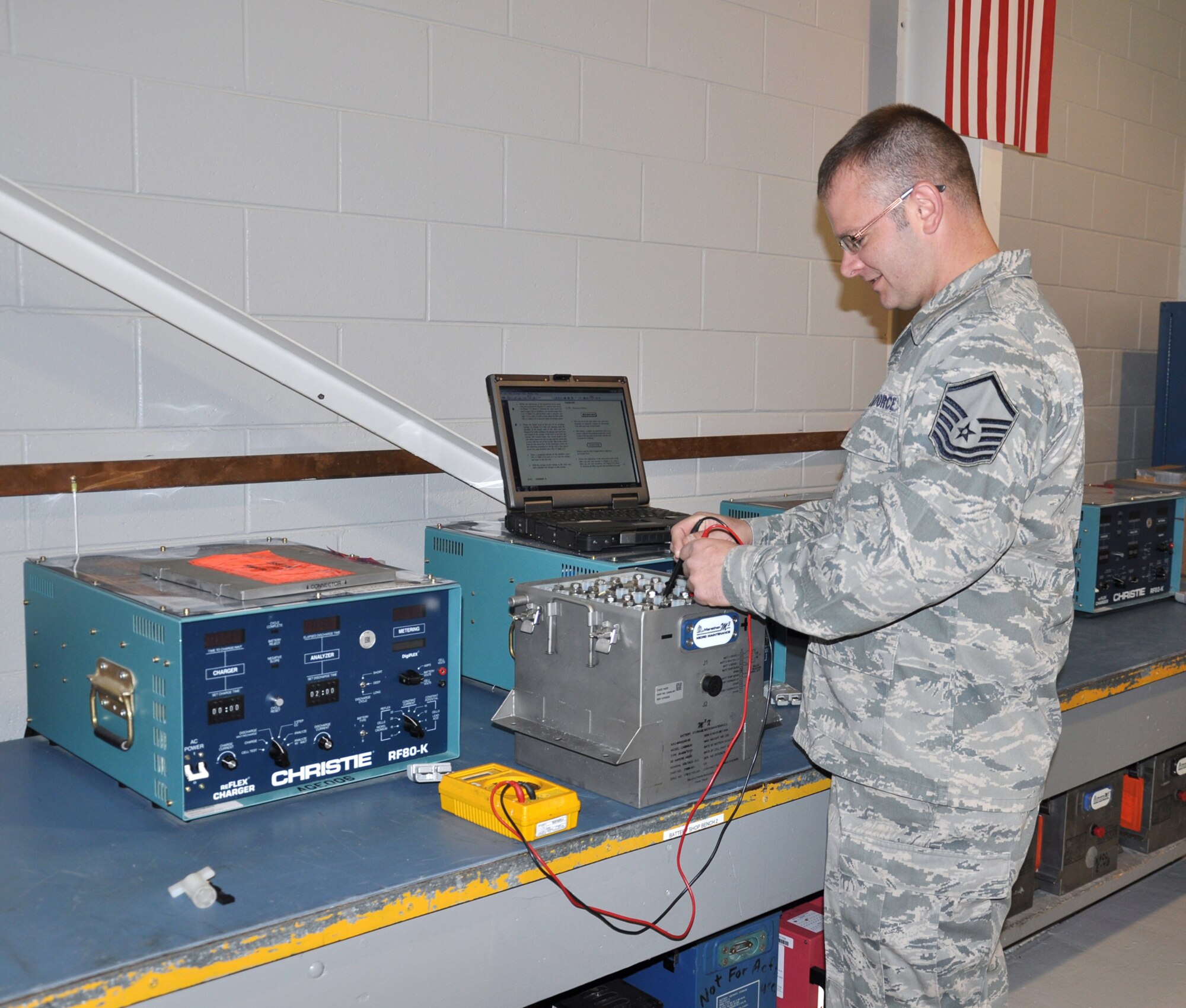 WRIGHT-PATTERSON AIR FORCE BASE, Ohio - Master Sgt. Charles Dyer, 445th Maintenance Squadron, checks a C-5 Galaxy battery for individual cell voltages prior to doing a capacity check to determine the battery's state of charge. (U.S. Air Force photo/Susan Belna)