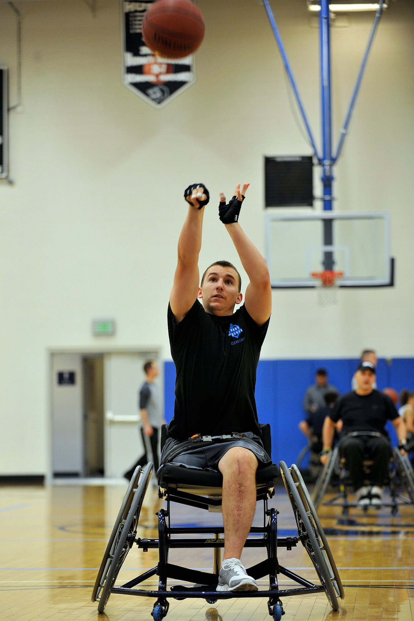 Air Force ROTC Cadet Matthew Pirrello, a member of the Air Force wheelchair basketball team, takes some shots May 12, 2011, at the Air Force Academy base gym while preparing for the 2011 Warrior Games. Cadet Pirrello lost his right leg and broke his left in a parachuting accident at the Academy last June. (U.S. Air Force photo/Bill Evans)
