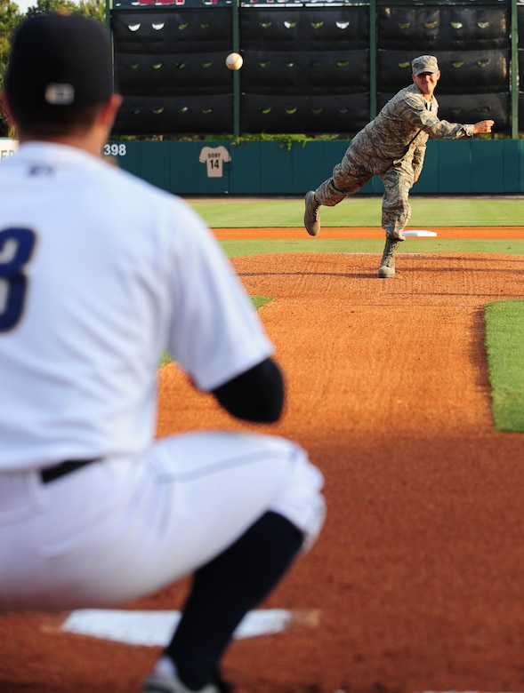 U.S. Air Force Staff Sgt. Andrew Maxon throws one of the opening pitches for the Charleston RiverDogs Military Appreciation night May 19, at Joseph P. Riley Jr Park in Charleston, S.C. Before the start of the game, military members took to the field with RiverDogs players for the presentation of the colors and the singing of the national anthem. Sergeant  Maxon is a C-17 mechanic assigned to the 315th Maintenance Squadron and recently returned from a deployment to Afghanistan. (U.S. Air Force photo/Tech. Sgt. Chrissy Best)
