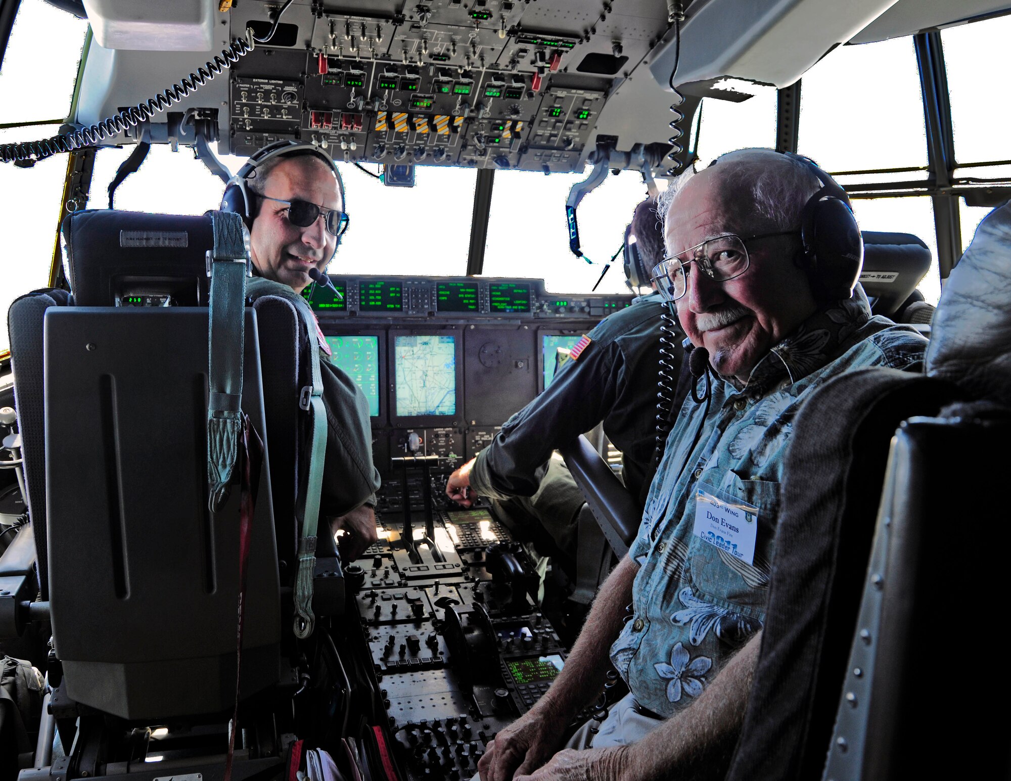 Brig. Gen. James Muscatell, 403rd Wing commander, took his last flight in the Air Force May 6 as he flew a group of Mississippi Gulf Coast residents home from the 403rd Wing's annual Civic Leader Tour.  The tour departed May 5 from Keesler Air Force Base, Miss., where General Muscatell and the civic leaders toured Niagara Falls Air Reserve Station, N. Y.  Upon return, General Muscatell invited one of the civic leaders, Don Evans, a former Army paratrooper, to sit on the flight deck with him for a portion of the flight.  Because of his Army job as a paratrooper, Mr. Evans had never been on board an aircraft during landing until General Muscatell's fini flight May 6.  (U.S. Air Force photo by Tech. Sgt. Tanya King)