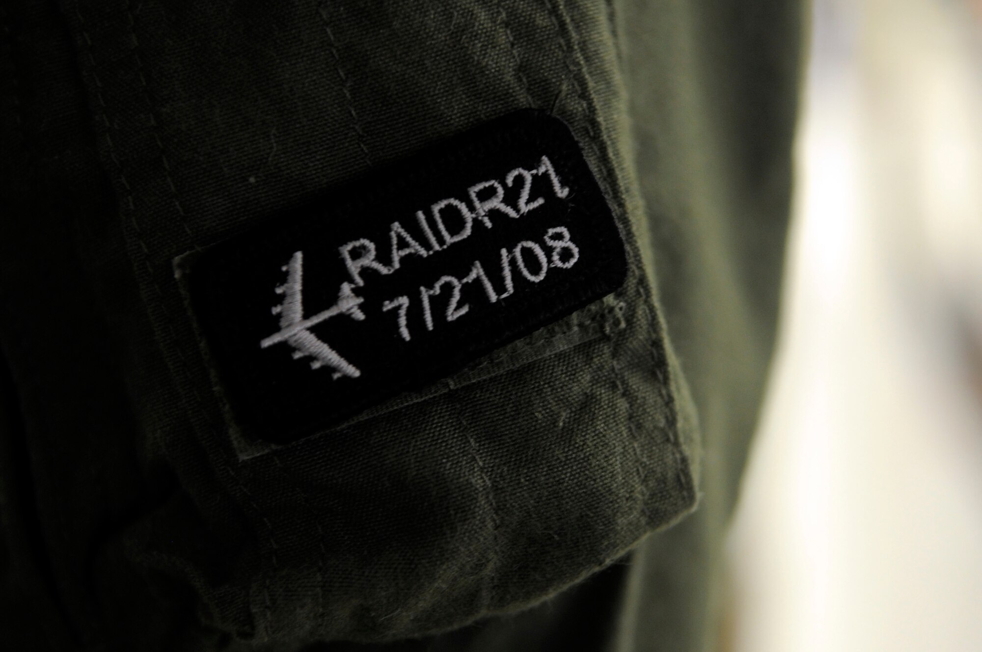 Aircrew from the bomber community sometimes wear a RAIDR 21 Tab patch to honor and remember their fallen brothers. RAIDR 21 was the call sign of a B-52H from Barksdale Air Force Base, La., which crashed off the coast of Guam July 21, 2008, killing the six aircrew. (U.S. Air Force photo/Staff Sgt. John Gordinier)(RELEASED)