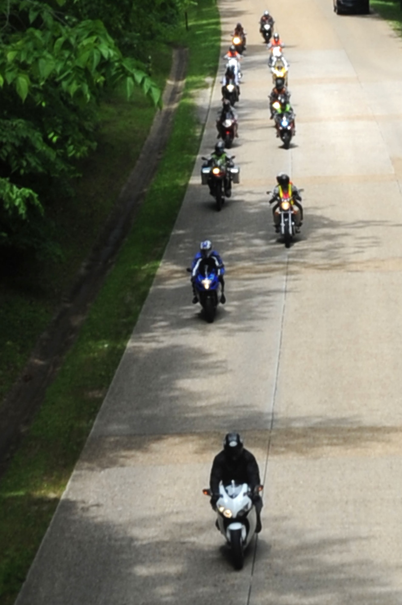 Participants of the National Police Week Warrior Ride drive down the Colonial Parkway in Yorktown, Va., May 19, 2011. The National Police Week event, which occurs each year, pays special recognition to those law enforcement officers, civilian and military, who have lost their lives in the line of duty for the safety and protection of others. (U.S. Air Force photo by Airman 1st Class Racheal Watson)(RELEASED)