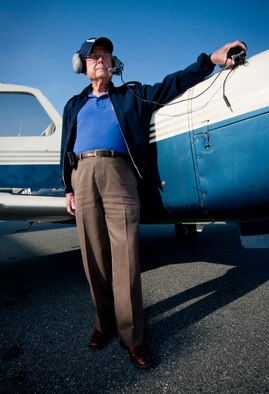 VALDOSTA, Ga.-- Retired Air Force Col. Clarence  Parker looks over the runway before taking his final flight at the Valdosta Regional Airport on May 20. Colonel Parker retired as the wing commander for Moody Air Force Base and has flown nearly 35 different aircraft during his 70 years of flying. (U.S. Air Force photo/Airman 1st Class Benjamin Wiseman)(RELEASED)