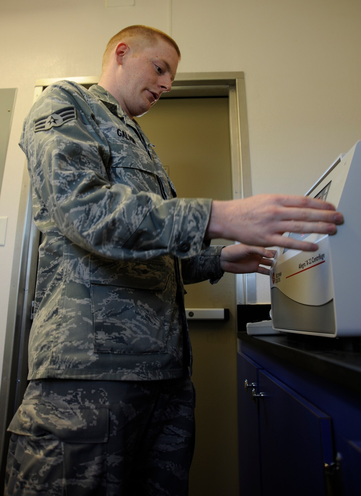 Senior Airman Connor Galvin, 22nd Medical Support Squadron biomedical equipment technician, monitors the revolutions per minute to ensure proper calibration on a centrifuge May13, 2011, McConnell Air Force Base, Kan. BMETs maintain equipment and ensure constant temperatures for the freezers where blood, vaccines and medications are kept. (U.S. Air Force photo/Airman 1st Class Armando A. Schwier-Morales)