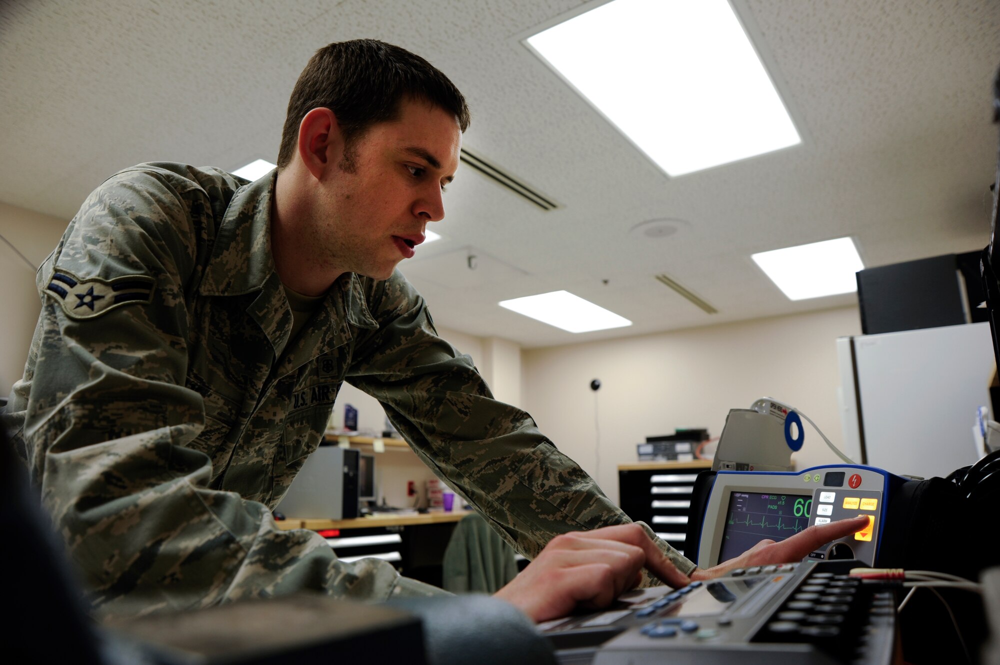 Airman 1st Class Lawrence Seay, 22nd Medical Support Squadron biomedical equipment technician, calibrates a defibrillator May 13, 2011, McConnell Air Force Base, Kan. BMETs service a wide variety of equipment such as dental chairs, sterilizers, defibrillators, x-ray equipment and blood pressure machines. (U.S. Air Force photo/Airman 1st Class Armando A. Schwier-Morales)