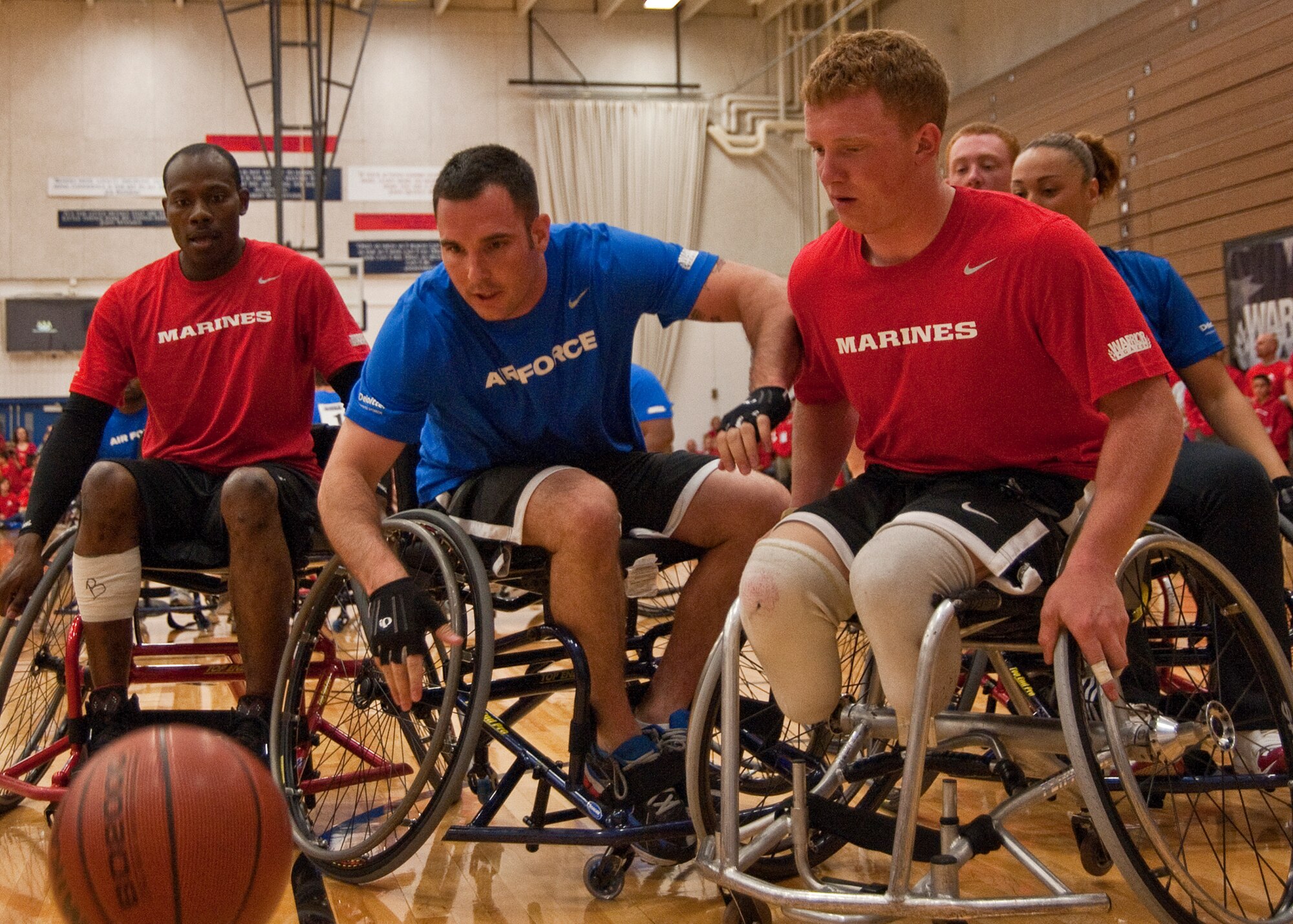 Air Force Staff Sgt. Christopher D?Angelo dives for a loose ball during wheelchair basketball at the 2011 Warrior Games in Colorado Springs, Colo. The Air Force lost to the Marine Corps 10 to 46 and will play the Navy for a bronze medal. (U.S. Air Force photo/Staff Sgt. J. Paul Croxon)