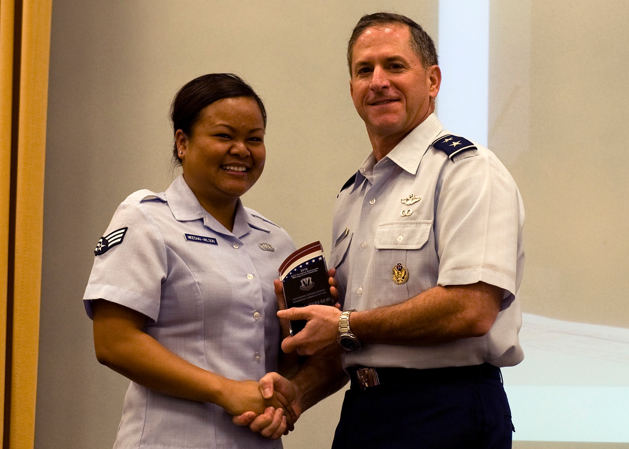 MOUNTAIN HOME AIR FORCE BASE, Idaho -- Senior Airman Anna Meechai, 319st Fighter Squadron, is presented the 2011 Aviation Resource Management Air Combat Command Airman of the Year Award from Maj. Gen. David Goldfein, ACC Director of Operations, at a ceremony at Langley Air Force Base, Va.  Airman Meechai is an Aviation Resource Management System Journeyman, who not only deployed on short notice to Korea last year, but identified errors in an Air Force Instruction that resulted in Air Force wide corrections. As a E4 she tracked an $83 million Flying Hour Program for the squadron, keeping it 100% accurate. She also volunteered more than 200 hours for the Airman Committed to Excellence group helping strengthen the bond between the base and community. SrA Anna Meechai represents the true pride and professionalism of the Gunfighters -- "Ride Hard, Shoot Straight and Always Speak the Truth." (Courtesy photo)