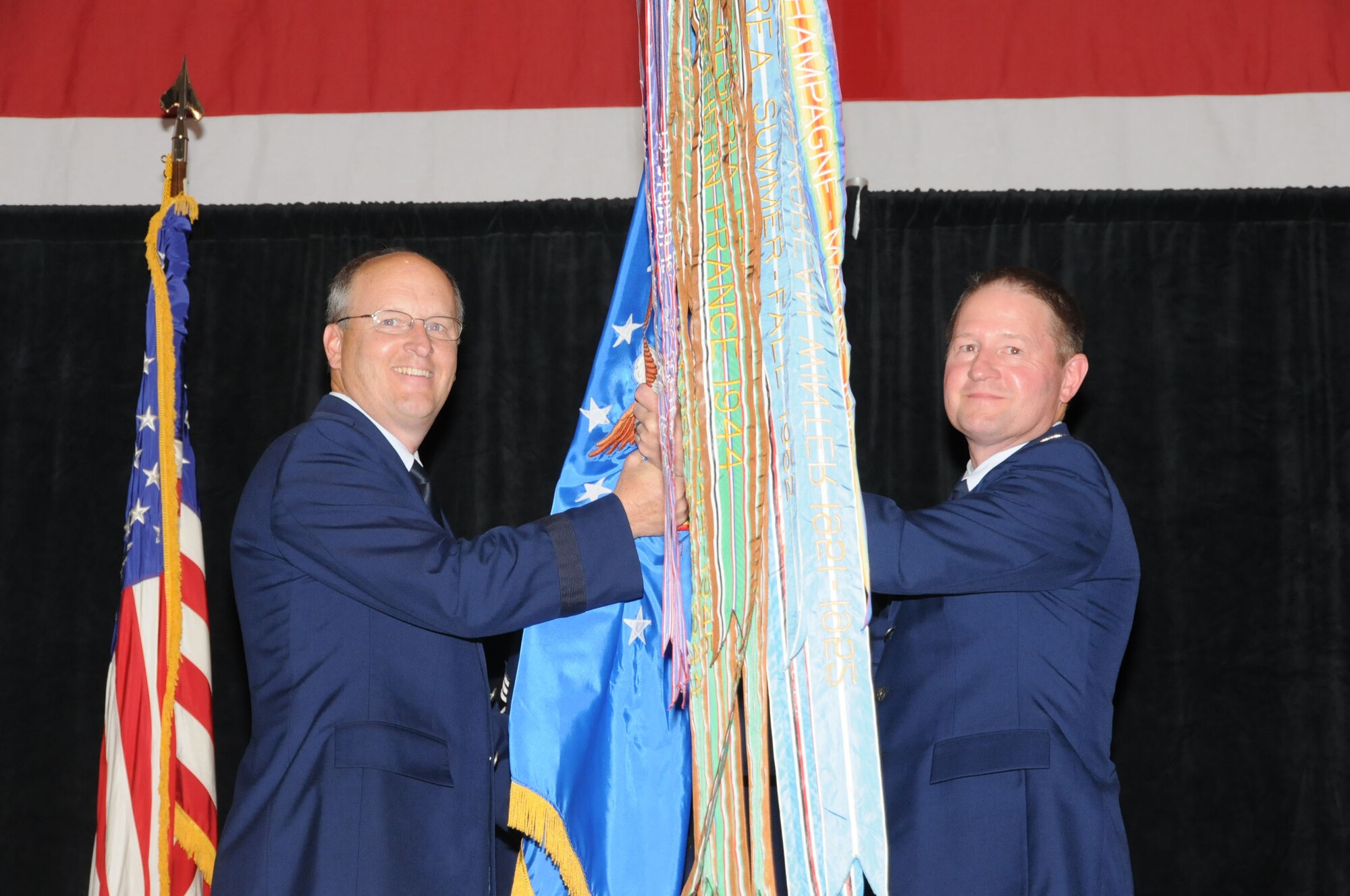 Col. Steve Eggensperger(right), incoming 189th Airlift Wing commander, accepts the wing flag from Brig. Gen. Dwight Balch, Arkansas Air National Guard commander, and as such, command of the unit May 15, 2011, at Little Rock Air Force Base, Ark. The 189th AW is equipped with C-130H Hercules aircraft and conducts entry-level loadmaster and flight engineer training through the Enlisted Aircrew Academic School, and provides initial and instructor aircrew qualification training for the Department of Defense and more than 20 allied nations. (U.S. Air Force photo/Master Sgt. Dianna Seerey)