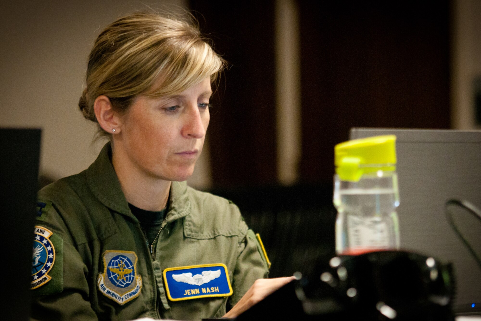 Capt. Jenn Nash coordinates long-range mission planning for the joint air operations center May 17, 2011, at the Kentucky Air National Guard Base in Louisville, Ky. The JAOC is supporting a major earthquake-response exercise by prioritizing and allocating air assets for missions into affected areas across the state. (U.S. Air Force Photo by Capt. John T. Stamm)