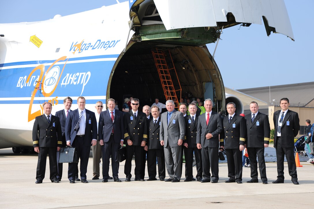 Executive leadership from and distinguished guests of Volga-Dnepr Airlines pose for a photo with the pilots and flight crew of the Russian AN-124-100 commercial cargo aircraft May 20. The Russian Antonov aircraft is newly on display at the 2011 Joint Service Open House here.The 2011 JSOH affords the public an opportunity to meet the men and women of the Armed Forces and to see military equipment from the Navy, Marines, Army, Air Force, and Coast Guard. The 2011 JSOH is planned and conducted through the efforts of active duty, guard and reserve servicemembers, as well as civilian employees, retirees and family members. (U.S. Marine Corps photo)