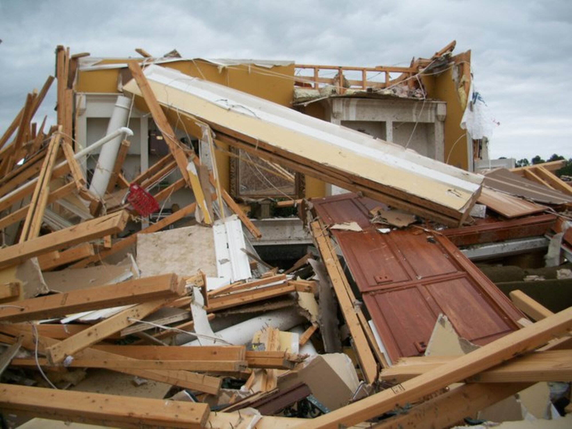 The home of Billy and Cynthia Arnold near Athens, Ala., was reduced to a pile of rubble by an April 27 tornado. The left side of the photo shows the walls of an interior half bathroom, thought to be the safest room in the house in the event of a tornado.  The Arnolds’ son, Stephen, is an ATA hydrogeologist at AEDC. (Photo provided)