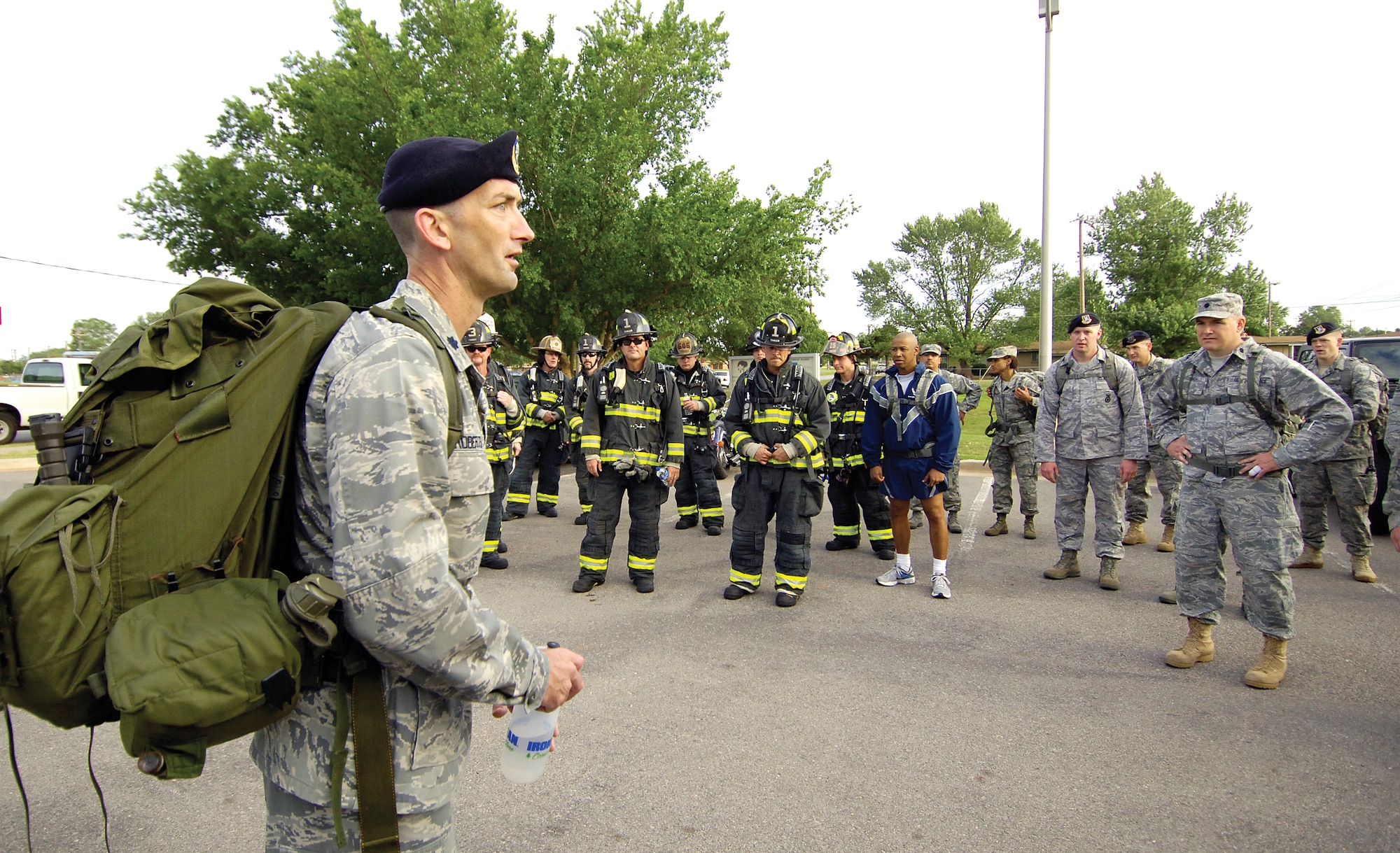 Lt. Col. Troy Roberts, 72nd SFS commander, thanks the participants at the end of the two-mile Ruck March May 18 during Police Week.  Tinker firefighters and members of other base organizations joined with the security forces members, hauling at least 35 pounds on their base march. (Air Force photo by Margo Wright)