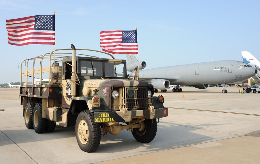 A restored 1970 Marine Corps M35A2 deuce-and-a-half, pictured with Air Force KC-10 Extender, is an example of the joint military equipment of past and present featured at the 2011 Joint Service Open House May 20 at Joint Base Andrews, Md. JSOH affords members of the public an excellent opportunity to meet and interact with the men and women of the Armed Forces and to showcase military equipment from the Navy, Marines, Army, Air Force and Coast Guard. JSOH is planned and conducted by Total Force; Active, Guard, Reserve, Civilian employees, as well as retirees and family. (U.S. Marine Corps. photo) 