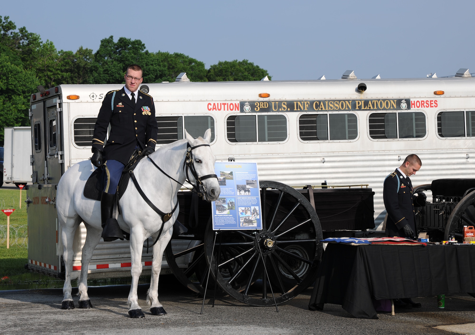 Army Specialist Joseph M. Staples, 3rd U.S. Infantry Caisson Platoon, Fort Meyers, Va., old guard member, stands ready with his horse Babe at the 2011 Joint Service Open House May 20. The 2011 JSOH affords members of the public an opportunity to meet and interact with the men and women of the Armed Forces and to showcase military equipment from the Navy, Marines, Army, Air Force, and Coast Guard. The 2011 JSOH is planned and conducted by active duty, guard, reserve, civilian employees, as well as retirees and family of military members. (U.S. Marine Corps photo)
