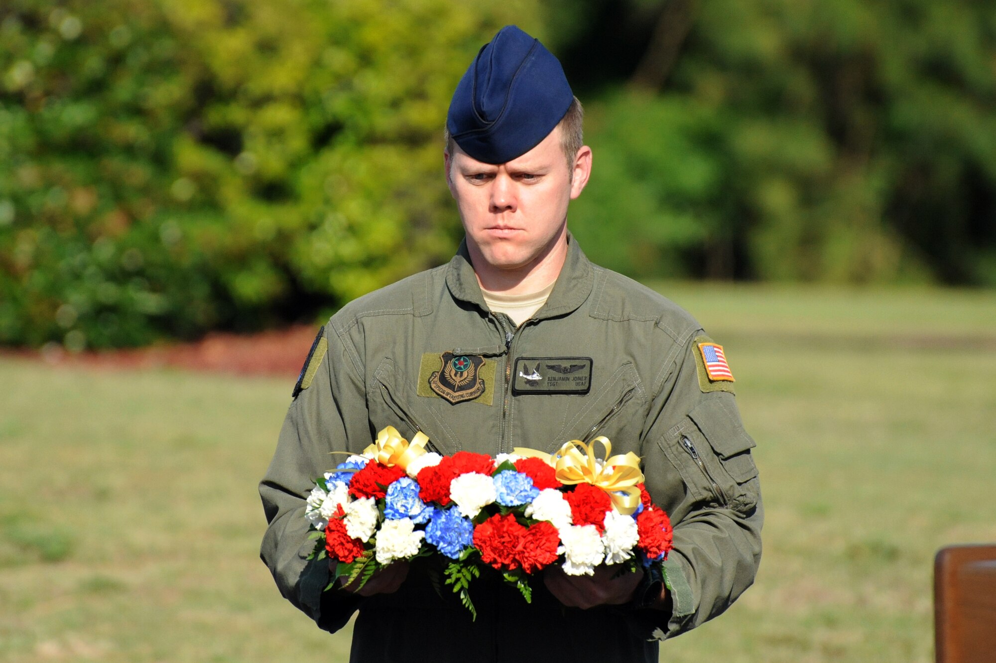 U.S. Air Force Tech. Sgt. Benjamin Joiner, 8th Special Operations Squadron flight engineer, presents a memorial wreath during the Storm 73 Memorial Ceremony, Hurlburt Field, Fla., May 18, 2011. The ceremony was in honor of the members who died in the line of duty when their CV-22 crashed in Afghanistan, April 9, 2010. (U.S. Air Force photo by Airman 1st Class Caitlin O'Neil-McKeown/RELEASED)


