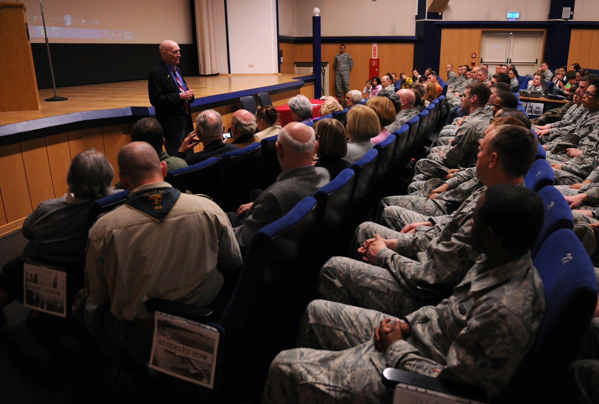 SPANGDAHLEM AIR BASE, Germany – Retired Col. Gail Halvorsen speaks to members of the 52nd Fighter Wing about the Berlin Airlift during his visit here May 18. Colonel Halvorsen dropped candy to Berlin children from 1947-1948 and earned the nickname “Candy Bomber.” (U.S. Air Force photo/Senior Airman Nathanael Callon)