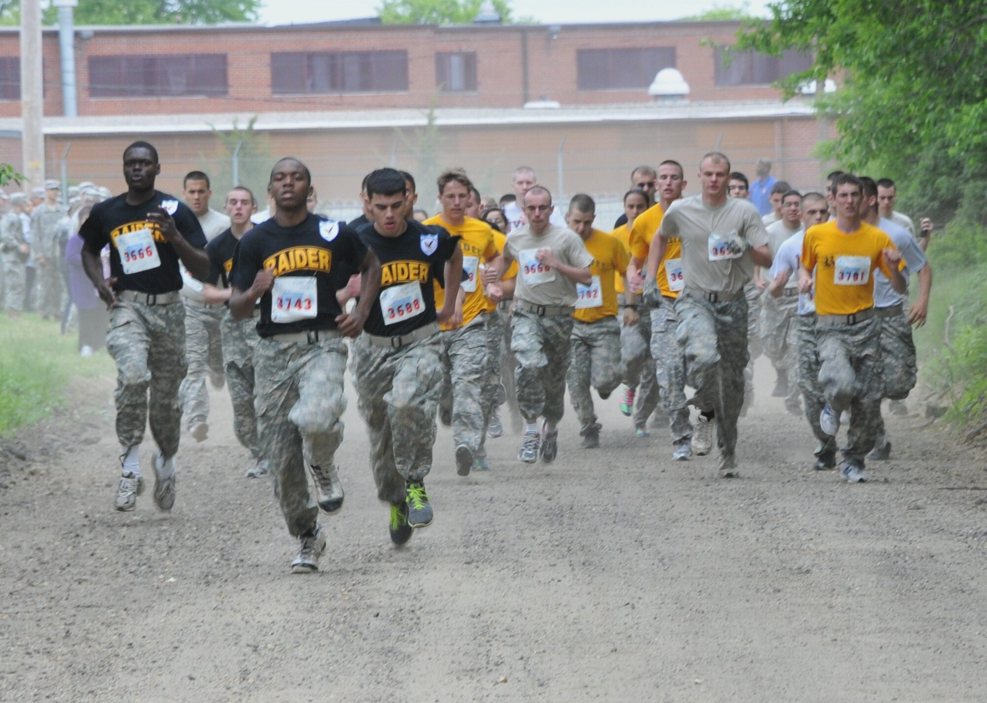 Junior Reserve Officer Training Corps cadets from ten regional high schools take off on the 2-mile run event during the 2011 Raider competition held here May 14. The Army Physical Fitness Test consist of how many push-ups and sit-ups can be conducted in a two-minute period in addition to a timed 2-mile run. (U.S. Air Force photo by Pascual Flores/Released)