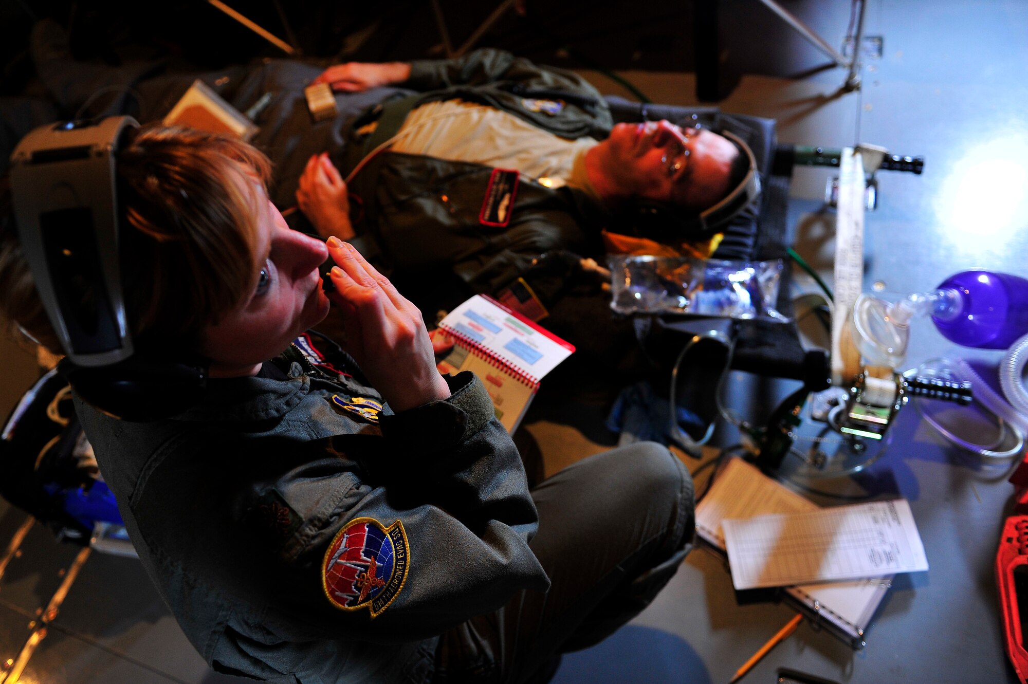Maj. Vickie Lagergren, 514th Aeromedical Evacuation Squadron medical crew director, communicates with the rest of her medical team while practicing different aerial evacuation scenarios involving injured patients as well as aircraft emergency situations. The team left Joint Base McGuire-Dix-Lakehurst May 13 for a three-day training mission to St. Croix, Virgin Islands. US Air Force photo by Staff Sgt. Jonathan Lovelady/Released)