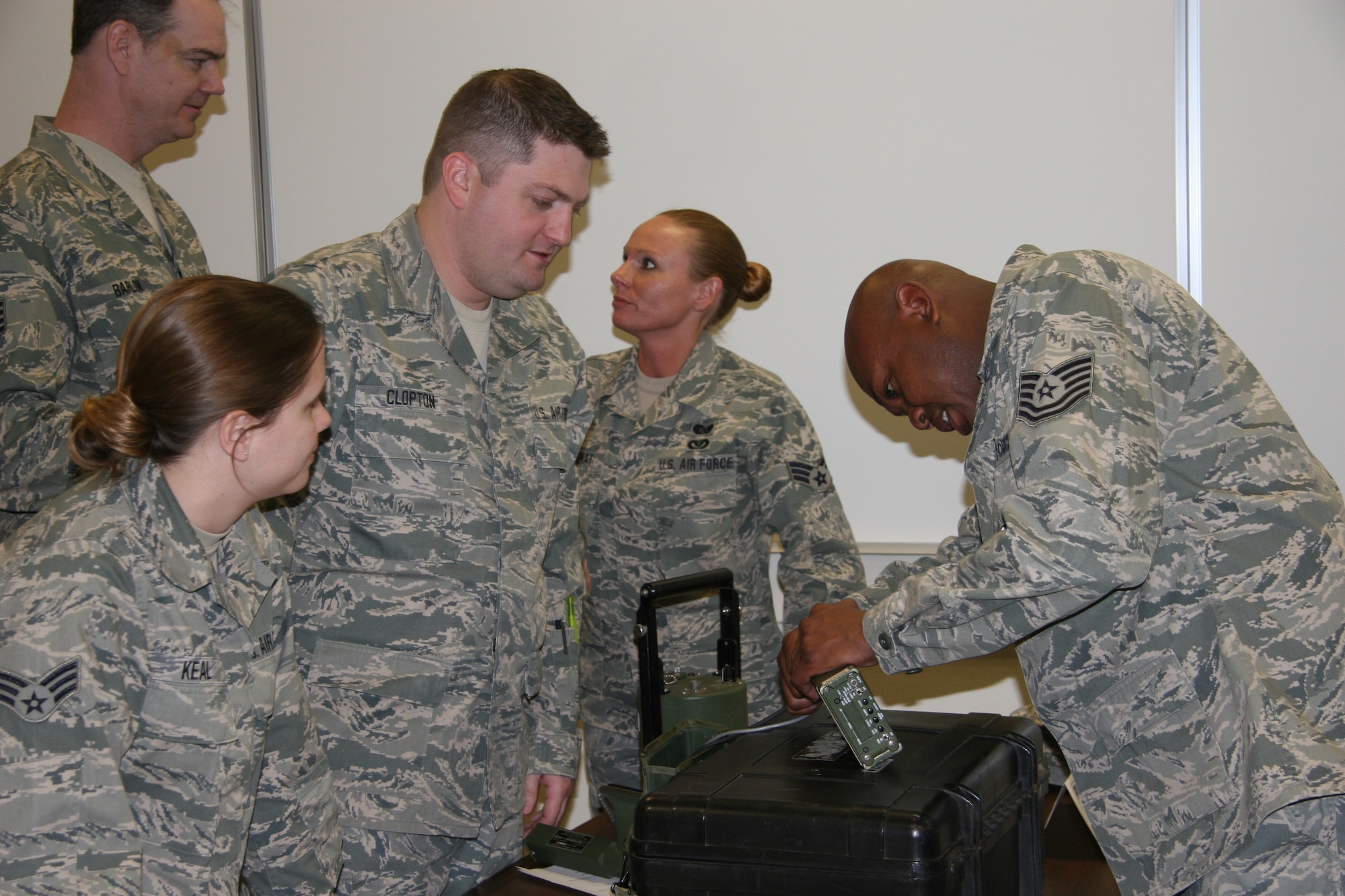 Tech Sgt. Jermaine Williams, right, teaches students how to properly use radiation detection equipment at the Defense Nuclear Weapons School.  Courtesy Photo by Ty Alley