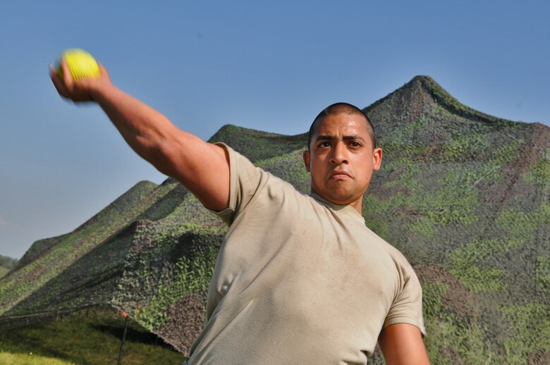 GEROLSTEIN, Germany – Airman 1st Class David Contreras, 606th Air Control Squadron ground radar technician, throws a softball during some downtime during exercise Eifel Thunder 2011 here May 10. The 606th ACS participated in a field exercise that tested their ability to deploy and set up a deployed radar and satellite communications site as well as everything else required to accomplish their mission. The squadron returned to Spangdahlem Air Base May 16. (U.S. Air Force photo/Senior Airman Nick Wilson)