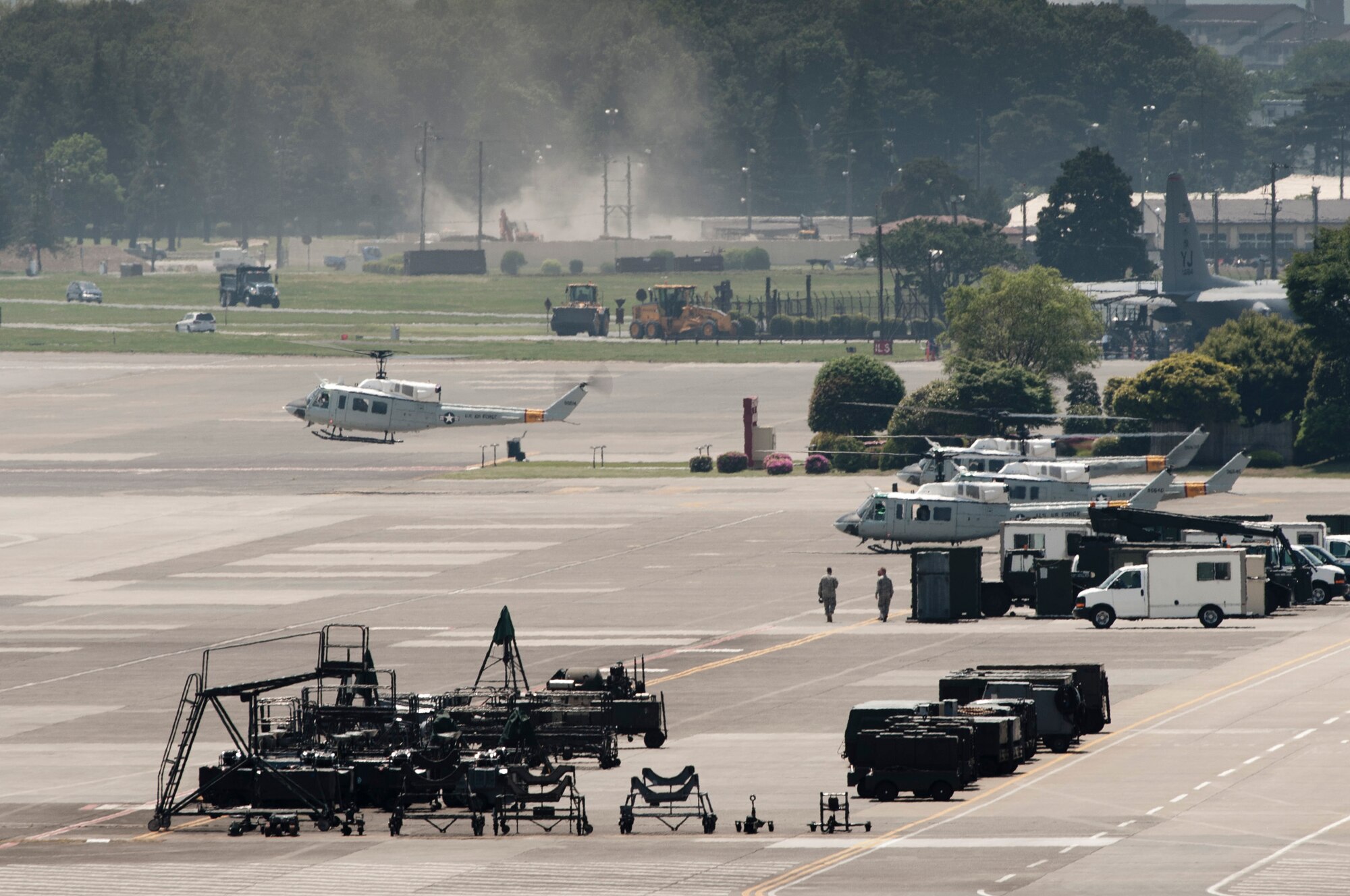 YOKOTA AIR BASE, Japan -- Four UH-1N Iroquois helicopters take off for a formation flight over southern Japan, May 19, 2011. (U.S. Air Force photo/Staff Sgt. Samuel Morse)