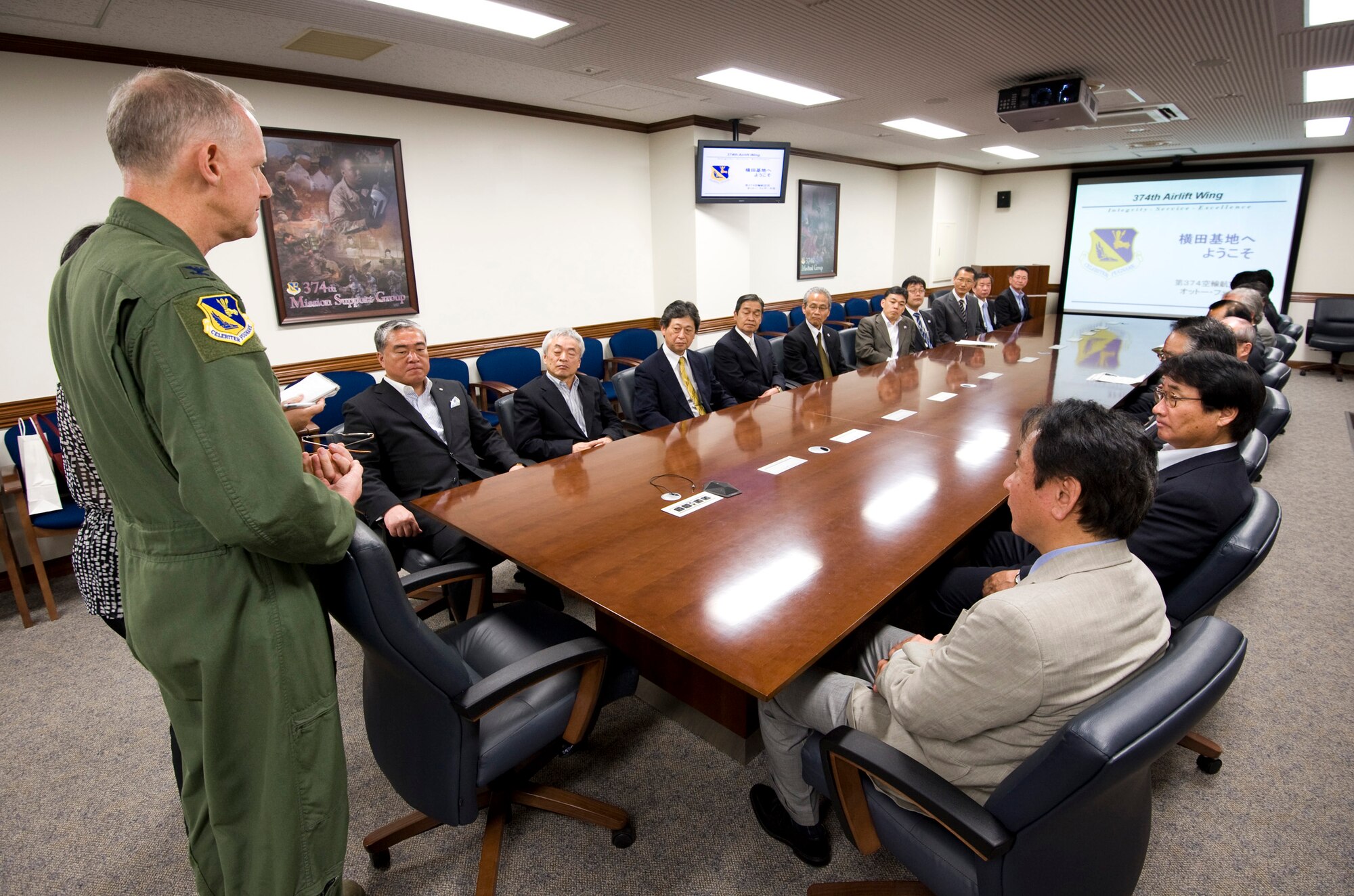 YOKOTA AIR BASE, Japan -- Col. Otto Feather, 374th Airlift Wing commander, welcomes a group of Japanese mayors to Yokota Air Base, Japan, May 18, 2011. Mizuho Town hosted an annual conference of mayors from the Tokyo area, and asked to bring them to Yokota Air Base to learn more about the U.S. Air Force's role in southern Japan. (U.S. Air Force photo/Staff Sgt. Samuel Morse)