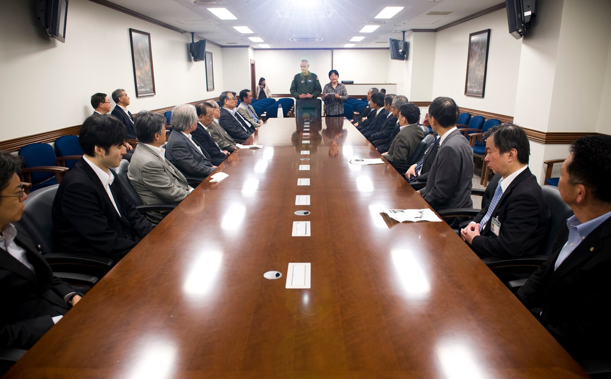 YOKOTA AIR BASE, Japan -- Col. Otto Feather, 374th Airlift Wing commander, welcomes a group of Japanese mayors to Yokota Air Base, Japan, May 18, 2011. Mizuho Town hosted an annual conference of mayors from the Tokyo area, and asked to bring them to Yokota Air Base to learn more about the U.S. Air Force's role in southern Japan. (U.S. Air Force photo/Staff Sgt. Samuel Morse)
