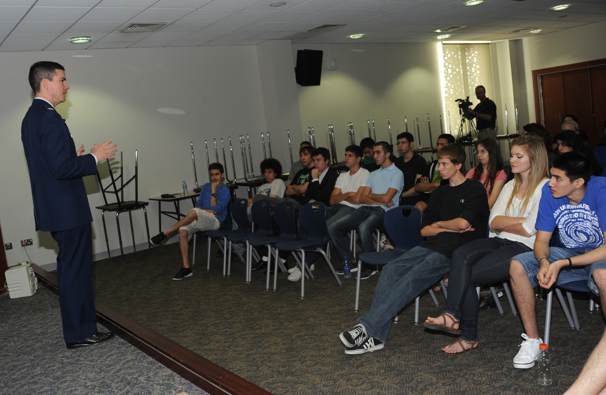 Col. Paul Tibbets IV, 379th Air Expeditionary Wing vice commander, talks to U.S. History students at the American school, May 18.  Col. Tibbets shared memories passed on by his grandfather, Brig. Gen. Paul Tibbets -- the man who dropped the bomb named "Little Boy" on Aug. 6, 1945. (U.S. Air Force photo/Staff Sgt. Liliana Moreno)