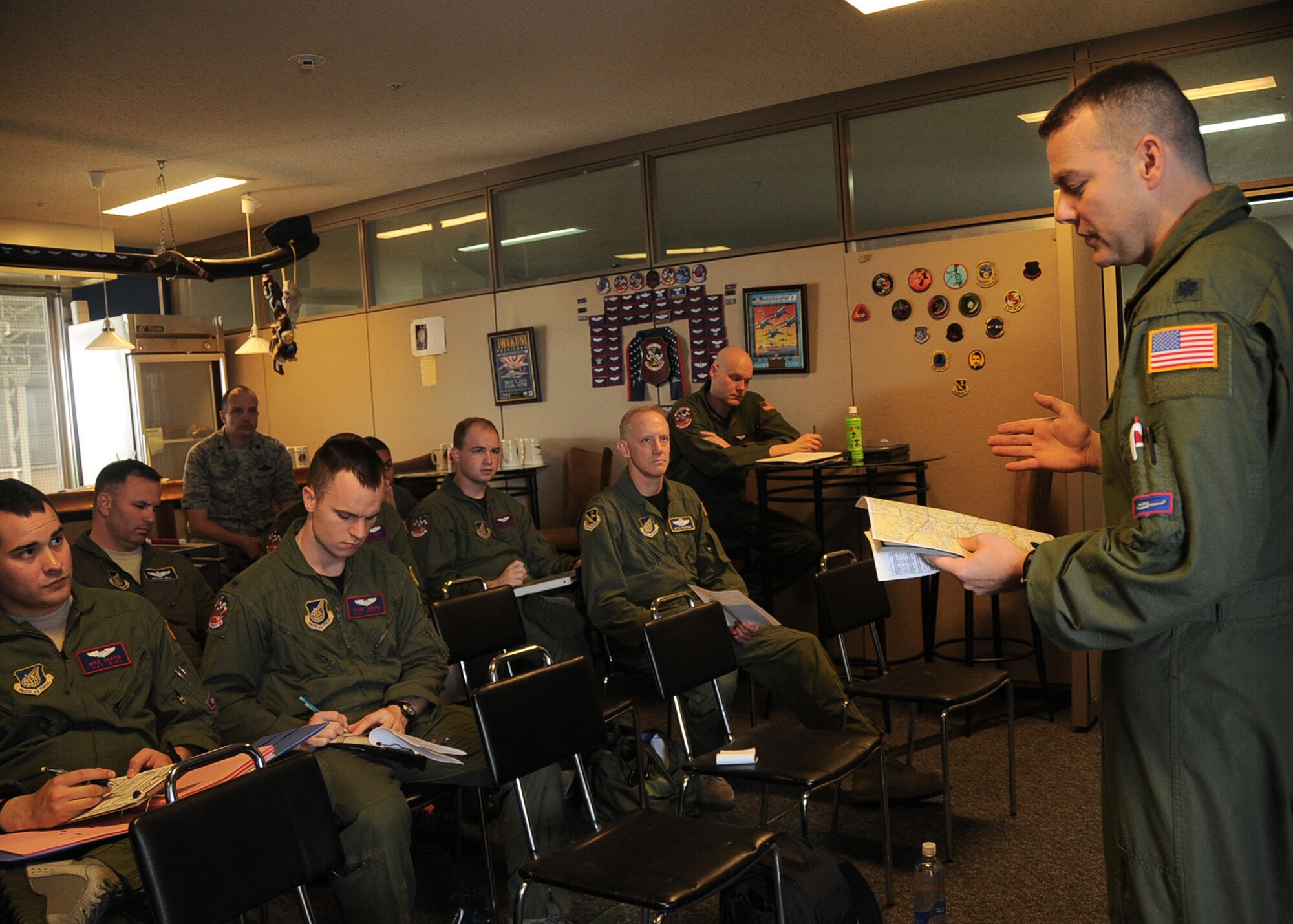 YOKOTA AIR BASE, Japan -- Lt. Col. Joshua Bowman, 459th Airlift Squadron, briefs flight instructions to aircrew members before a four-ship UH-1N Iroquois helicopter formation flight at Yokota Air Base, Japan, May 19, 2011. This was the first time since 2002 that all four aircraft took to the air together. (U.S. Air Force photo/Senior Airman Andrea Salazar)