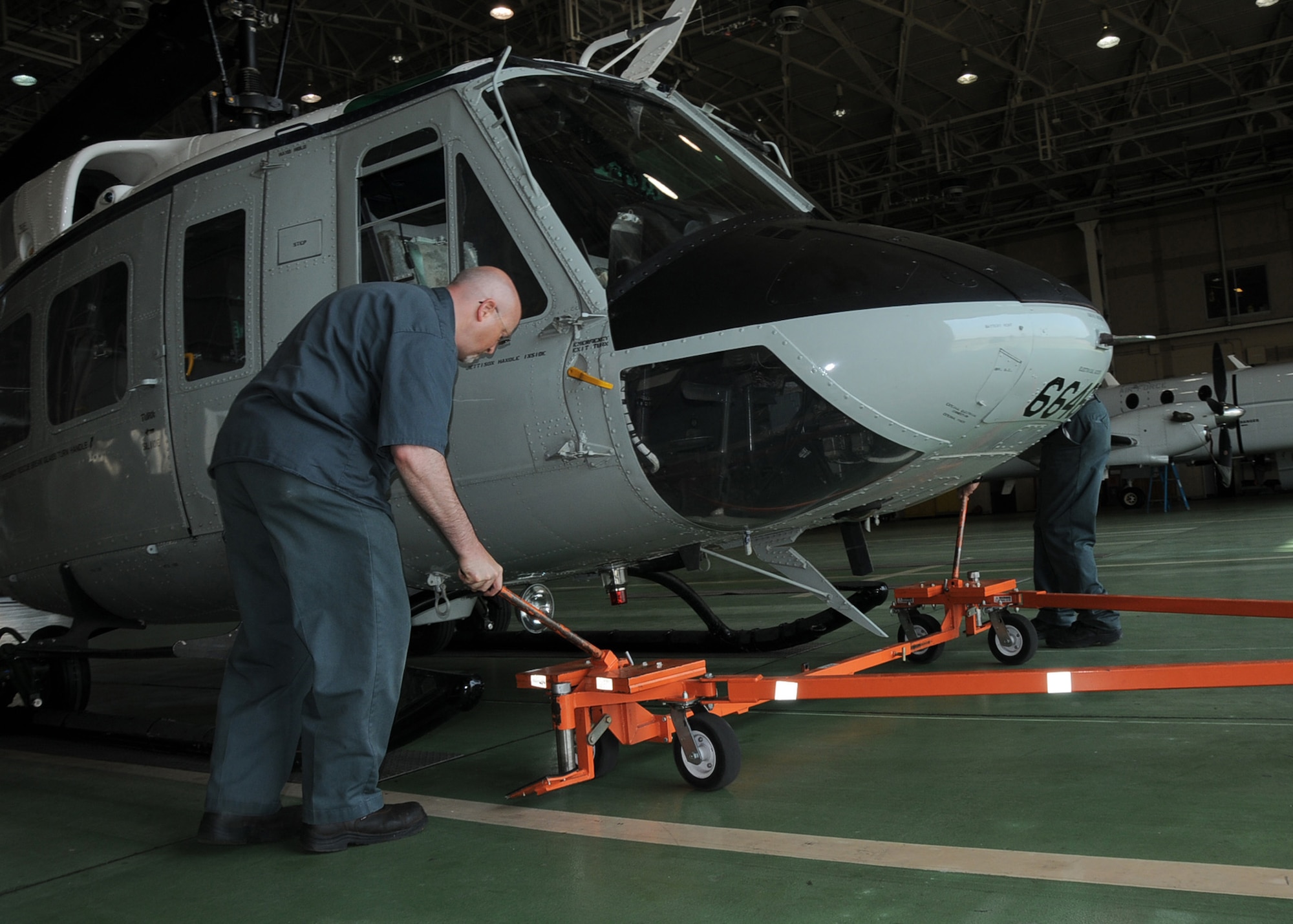 YOKOTA AIR BASE, Japan -- Jason Turk, 374th Maintenance Operations Squadron maintenance technician, prepares a UH-1N Iroquois helicopter for preflight inspections at Yokota Air Base, Japan, May 19, 2011. Yokota members worked together to make a successful formation flight. (U.S. Air Force photo/Senior Airman Andrea Salazar)
