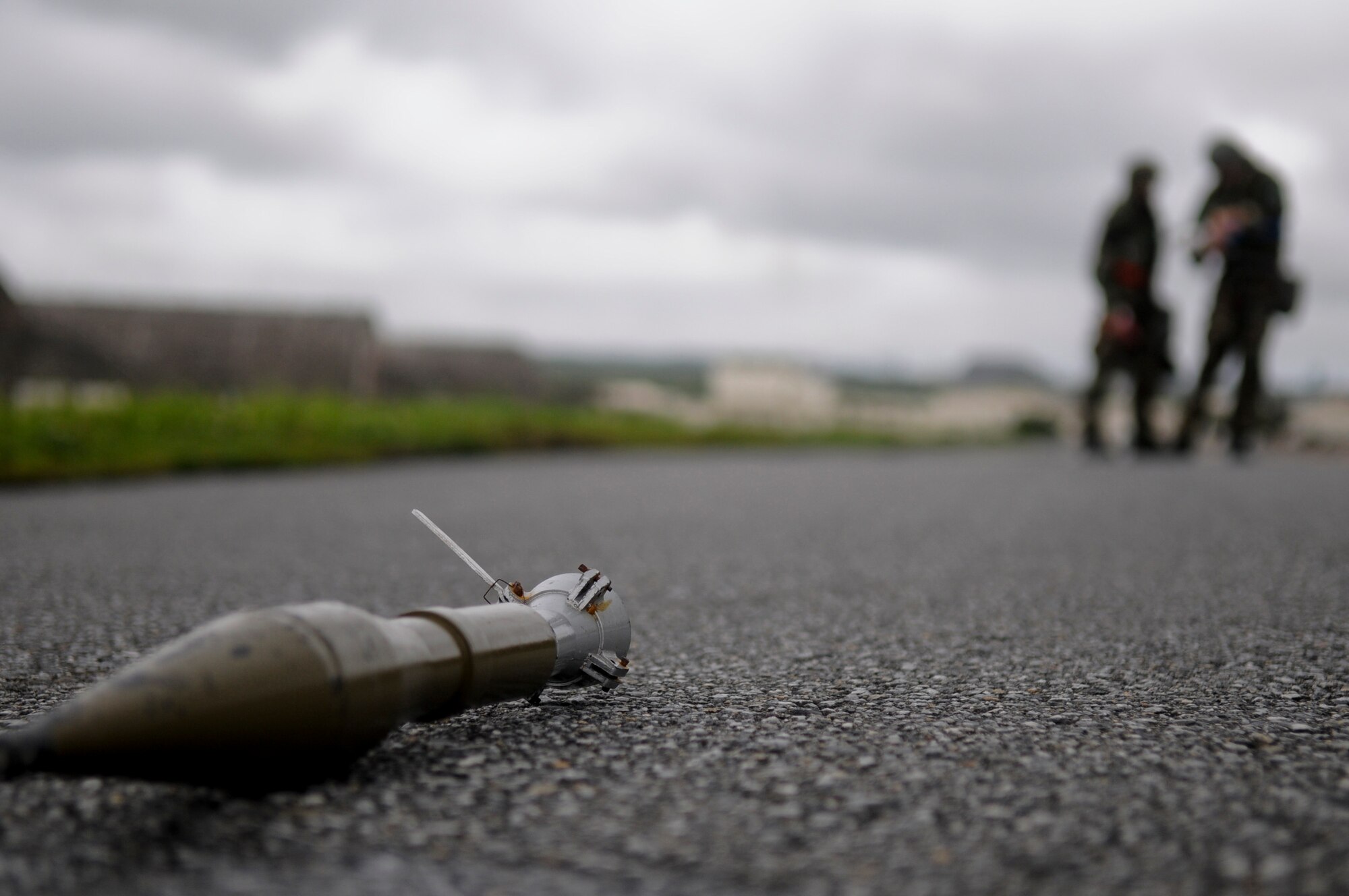 Airmen from the 67th Aircraft Maintenance Unit encounter simulated unexploded ordnance during a post-attack reconnaissance sweep after a simulated aerial attack on Kadena as part of Beverly High 11-4, a local operational readiness exercise, on Kadena Air Base, May 19. Airmen use these PAR sweeps to locate any potential threats or possible victims following an attack on the installation to ensure the safety of others in the area. (U.S. Air Force photo/ Airman 1st Class Maeson L. Elleman)