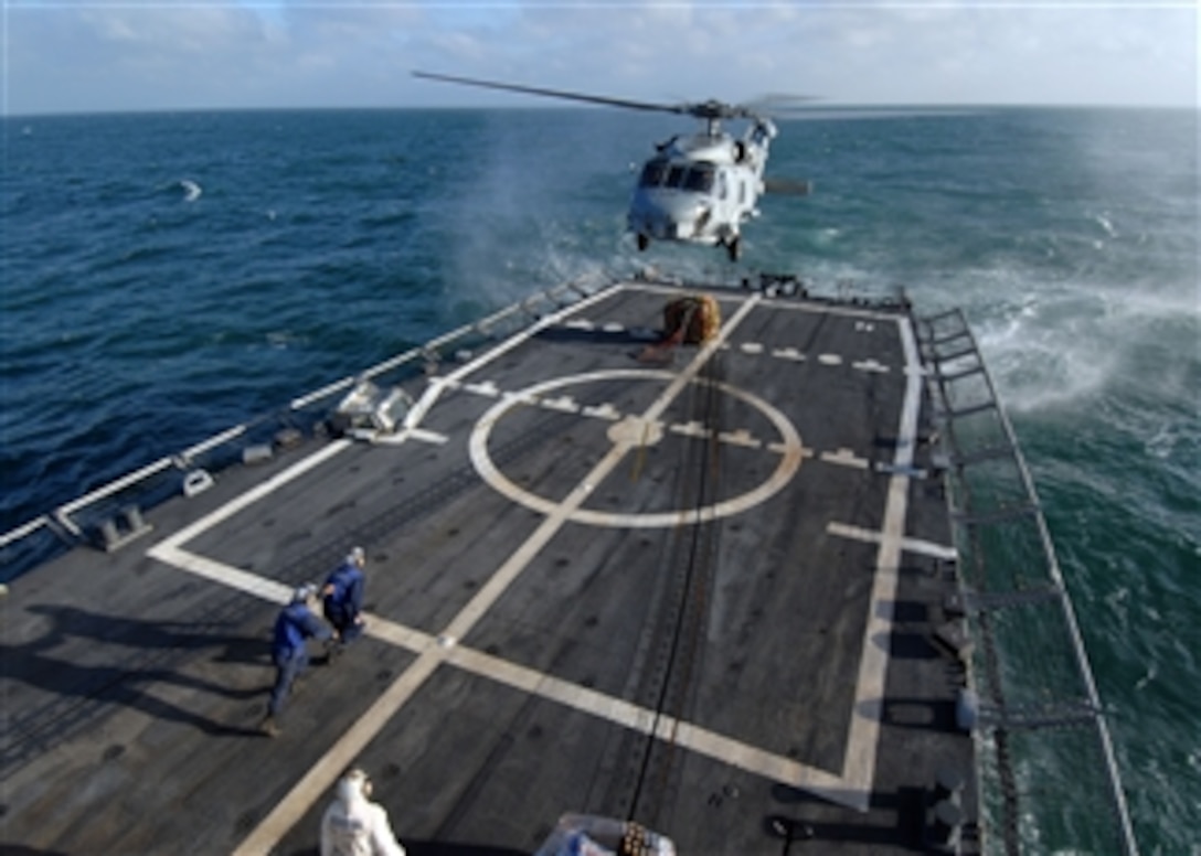 U.S. Navy sailors aboard the guided missile frigate USS Boone (FFG 28) prepare to attach a pallet of supplies to an SH-60B Seahawk helicopter assigned to Helicopter Anti-Submarine Squadron Light 44 during a vertical replenishment with the guided missile frigate USS Thach (FFG 43) in the Atlantic Ocean on May 10, 2011.  The Boone and the Thach were participating in Southern Seas 2011.  Southern Seas is a U.S. Southern Command-directed operation designed to strengthen relationships with regional partner nations and improve operational readiness.  