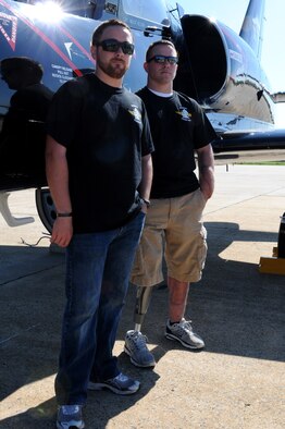 JOINT BASE ANDREWS, Md. -- Marine Lance Cpl. Eli Tice (right) and brother Alex Tice pose for a photo in front of a L-39 Albatros belonging to the Wounded Warrior Flight Team during the Joint Service Open House here May 21, 2011. Corporal Tice and soon Alex, will be taking part in a flight training program sponsored and paid for by the WWFT. The WWFT is a charitable organization that helps wounded veterans obtain vocational training and eventually earn full time employment. The WWFT travels to military events like the JSOH in order to spread awareness and gain support for it's Wounded Warroir job training programs. (U.S. Air Force photo/Tech Sgt.Steve Lewis)