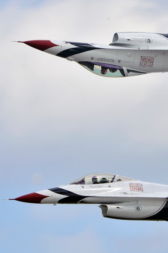 The Thunderbirds perform for a crowd of approximately 100,000 people during the 2011 Joint Service Open House here May 21. The JSOH affords the public an opportunity to meet the men and women of the Armed Forces and to see military equipment through the efforts of active duty guard and reserve servicemembers, as well as civilians employees, retirees and family members. (U.S. Air Force photo by Senior Airman Perry Aston) 