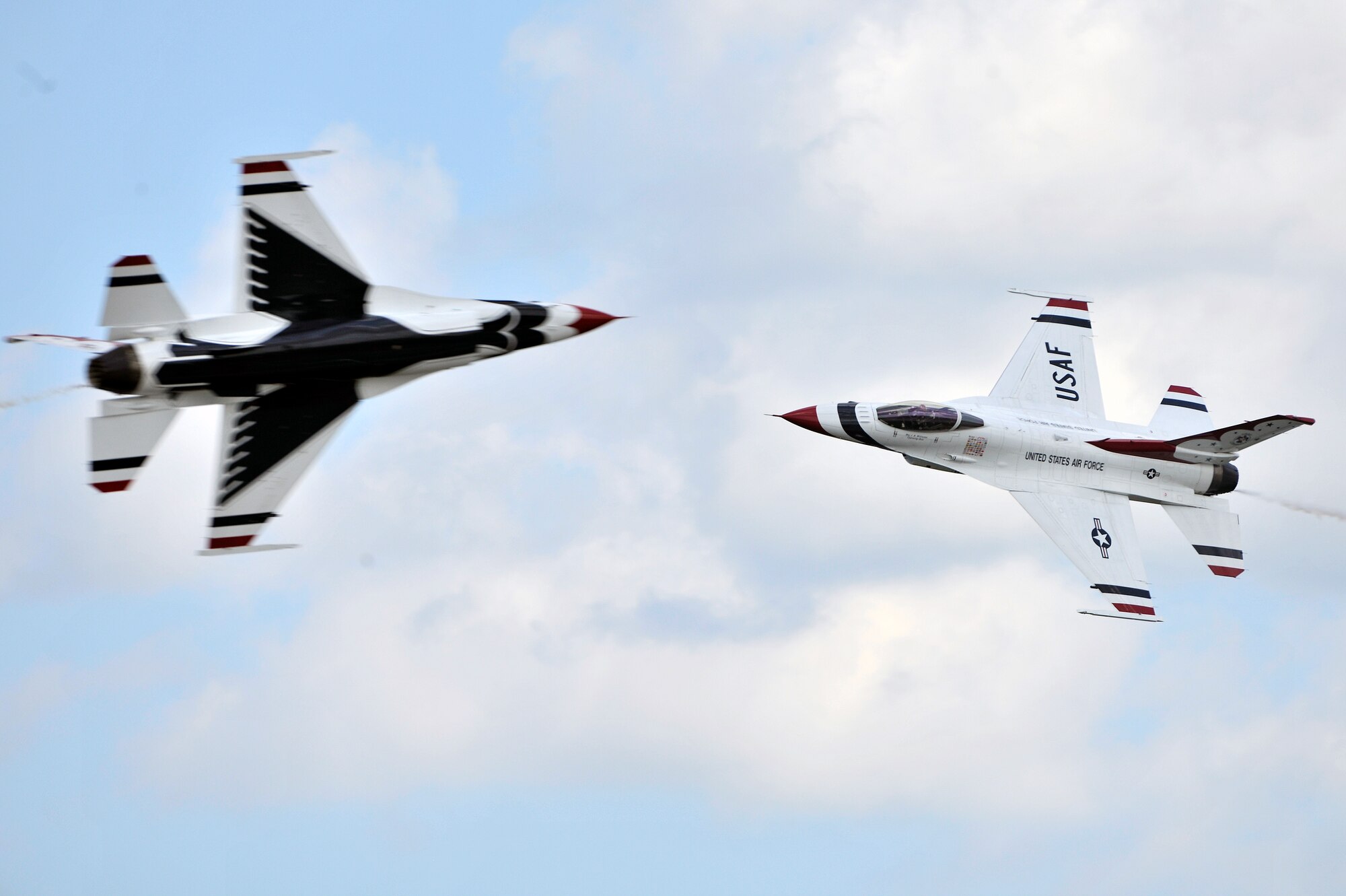 The Thunderbirds perform for a crowd of approximately 100,000 people during the 2011 Joint Service Open House here May 21. The JSOH affords the public an opportunity to meet the men and women of the Armed Forces and to see military equipment through the efforts of active duty guard and reserve servicemembers, as well as civilians employees, retirees and family members. (U.S. Air Force photo by Senior Airman Perry Aston) 