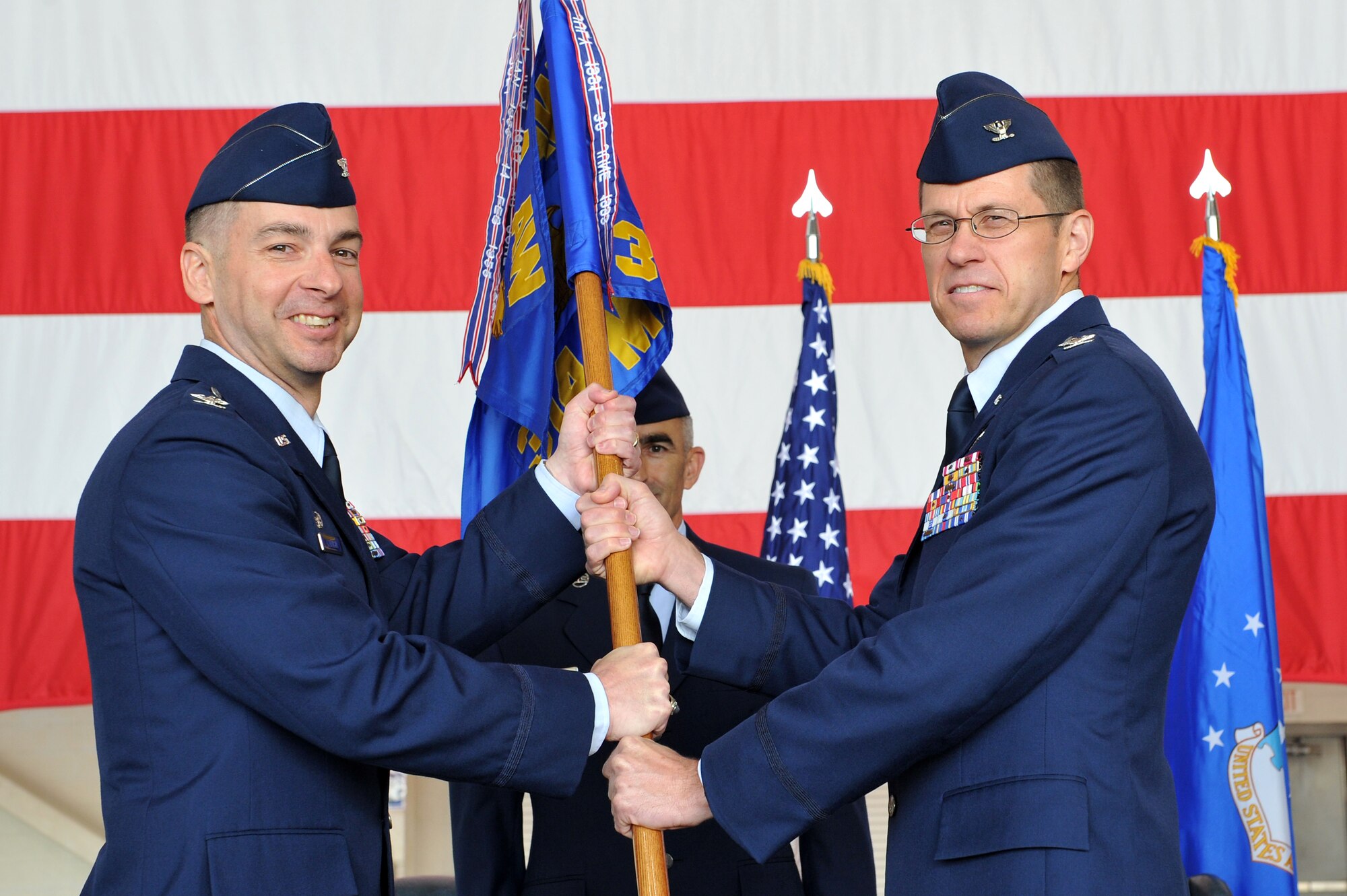 Col. Mark Czelusta, 314th Airlift Wing commander, passes the guidon to Col. Steven Weld and, as such, command of the 314th Maintenance Group May 16, 2011, at Little Rock Air Force Base, Ark. The 314th MXG directs and coordinates all aircraft maintenance activities and logistics support for 28 C-130 aircraft. The 314th MXG provides sortie production and aircraft equipment support for the Department of Defense C-130 formal school, Air Mobility Command, Air Combat Command airlift units, and 42 nations. (U.S. Air Force photo/Staff Sgt. Chris Willis)