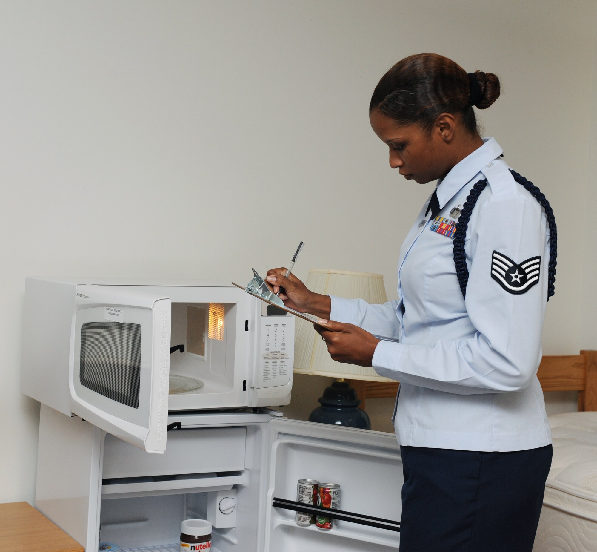 Staff Sgt. CheLeta Brown, 714th Training Squadron Military Training Leader flight chief, looks for cleanliness May 16, 2011, at Little Rock Air Force Base, Ark. MTLs conduct room inspections to ensure Airmen keep their room clean at all times.  (U.S. Air Force photo/Airman 1st Class Ellora Stewart)