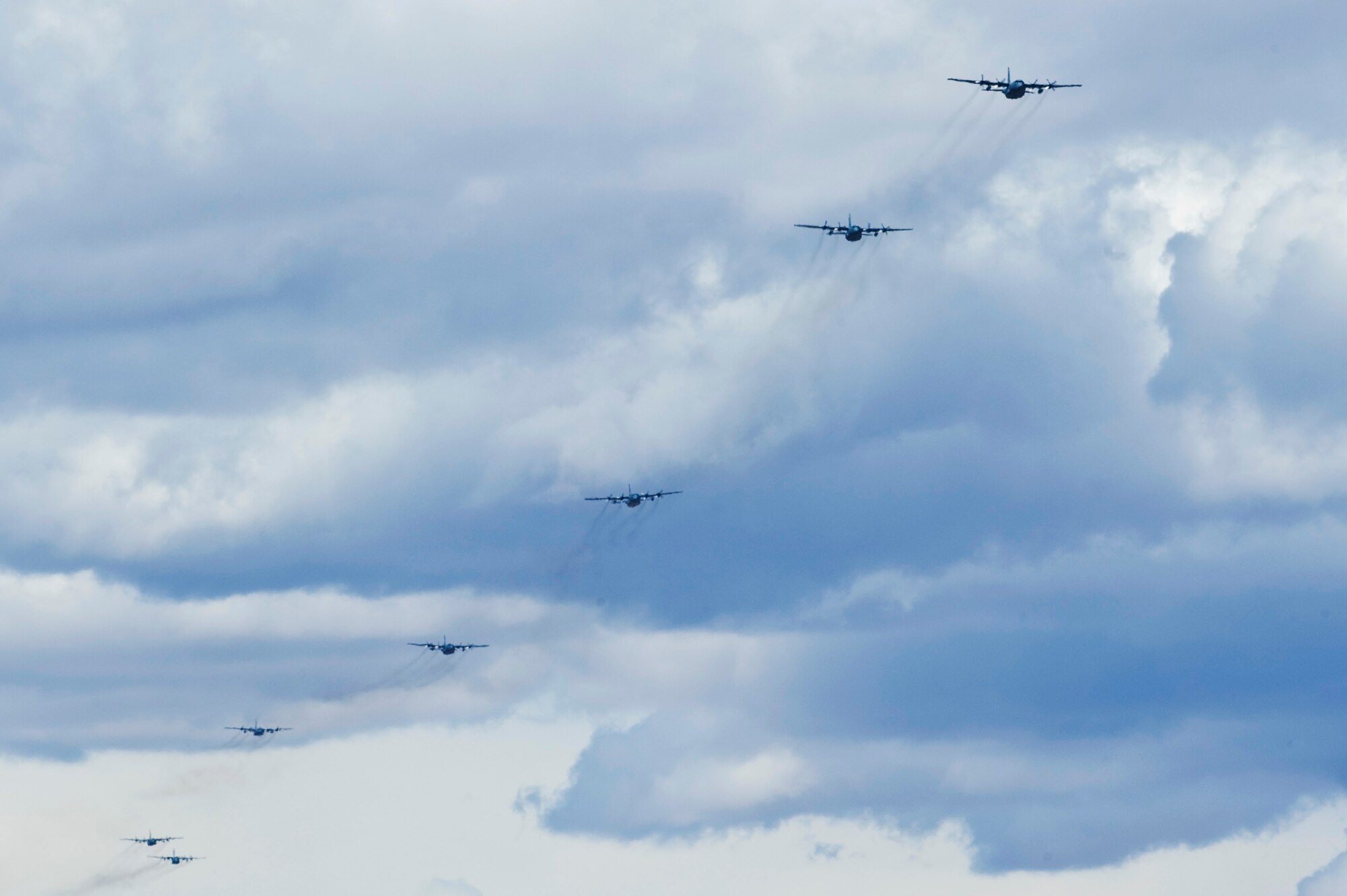 A formation of  U.S. Air Force C-130 Hercules aircraft approach Nellis Air Force Base, Nev. after completing a Mobility Forces Exercise mission May 18.  Approximately 40 C-17 Globemaster III and C-130 aircraft assembled in aerial formations over the Nevada Test and Training Range to conduct air and ground operations as part of the bi-annual U.S. Air Force Weapons School training event. (U.S. Air Force photo/Senior Airman Brett Clashman)

