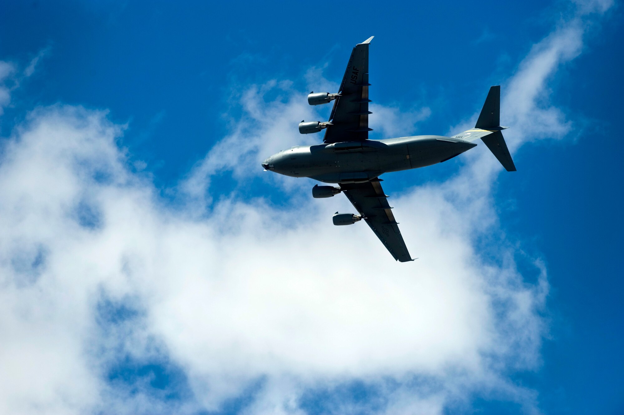 A U.S. Air Force C-17 Globemaster III flies over Nellis Air Force Base, Nev. after completing a Mobility Forces Exercise mission May 18. Approximately 40 C-17 and C-130 Hercules aircraft assembled in aerial formations over the Nevada Test and Training Range to conduct air and ground operations as part of the bi-annual, U.S. Air Force Weapons School training event. (U.S. Air Force photo/Senior Airman Brett Clashman)
