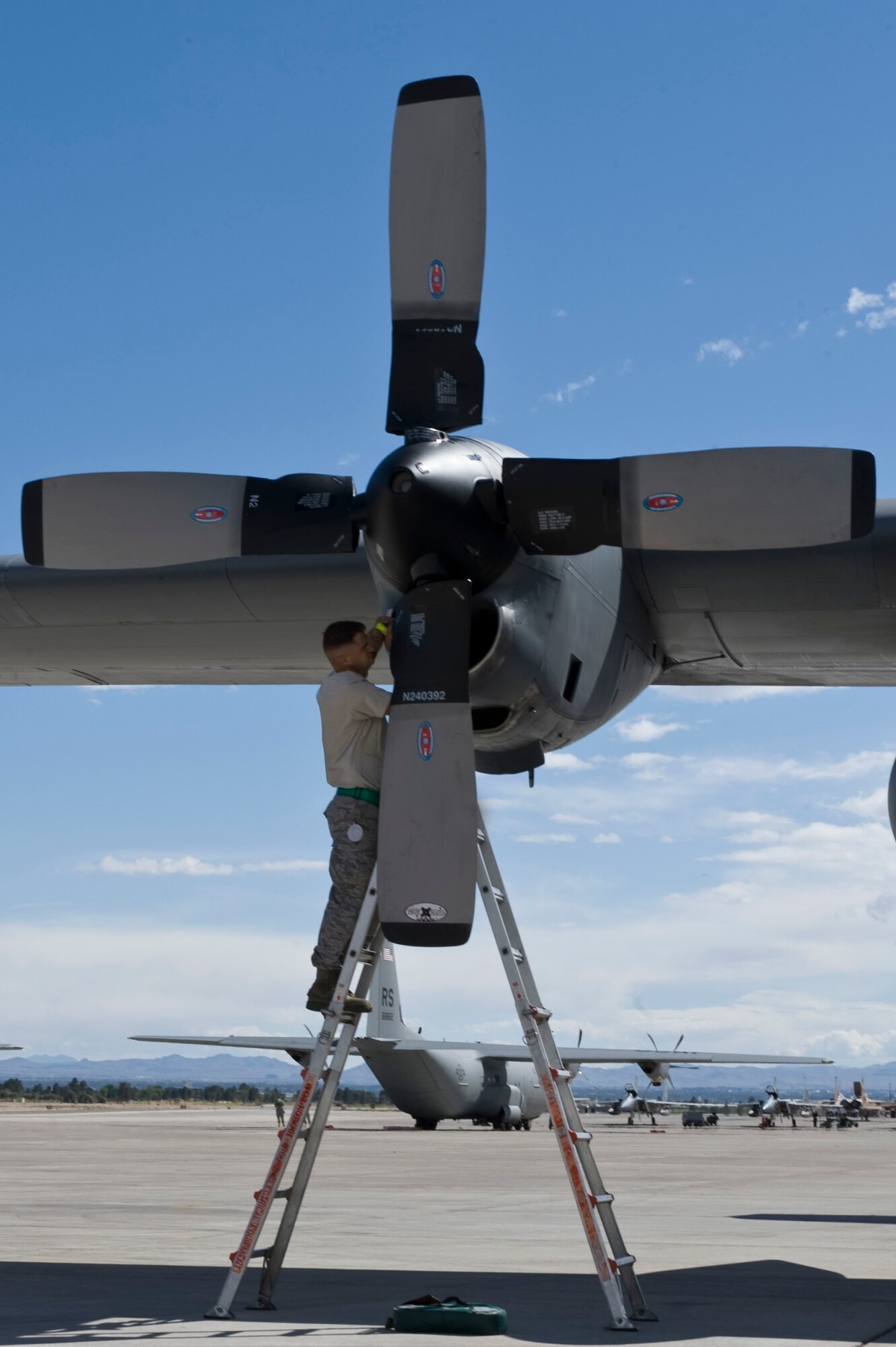 U.S. Air Force Staff Sgt. Christopher Rhodus, a C-130 Hercules crew chief assigned to the19th Aircraft Maintenance Squadron, Little Rock Air Force Base, Ark., performs intake and exhaust inspection at Nellis Air Force Base, Nev., following a Mobility Forces Exercise mission May 18. Approximately 40 C-17 Globemaster III and C-130 aircraft assembled in aerial formations over the Nevada Test and Training Range to conduct air and ground operations as part of the bi-annual, U.S. Air Force Weapons School training event. (U.S. Air Force photo/Airman 1st Class Matthew Lancaster)